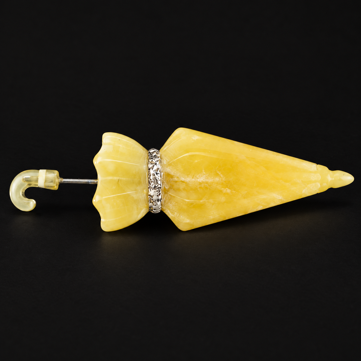 KIZIMA Baltic amber brooch 20S0846q2.82 on black studio background.