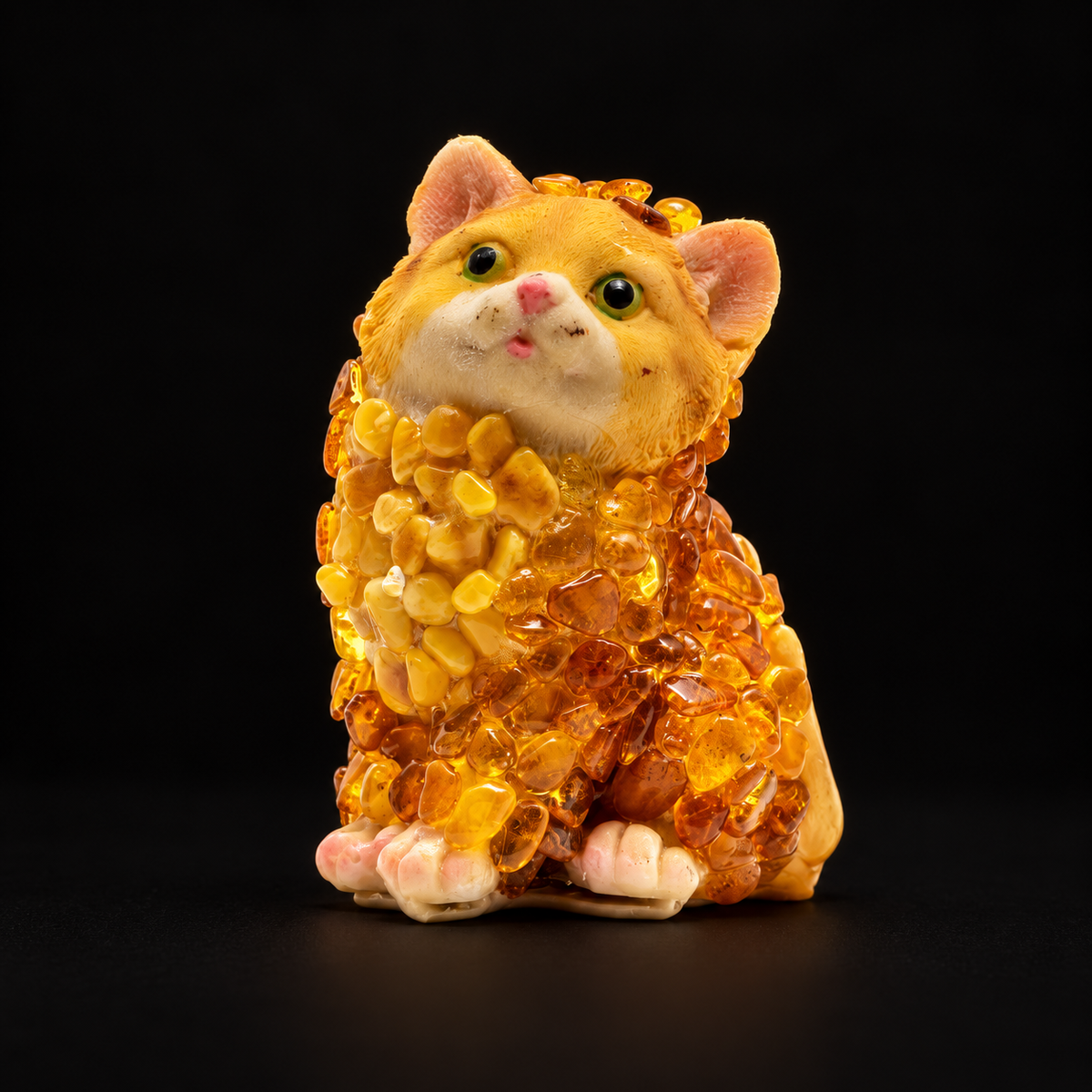 Made in USA Natural Baltic Amber sitting cat figurine with tilted face and planted paws, amber mosaic kitten, black studio background — KIZIMA®