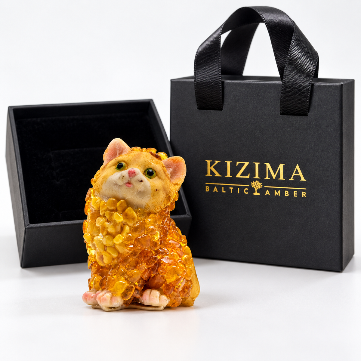 Baltic amber sitting cat figurine with black velvet-lined KIZIMA® gift box and gift bag — ready-to-give cat lover gift