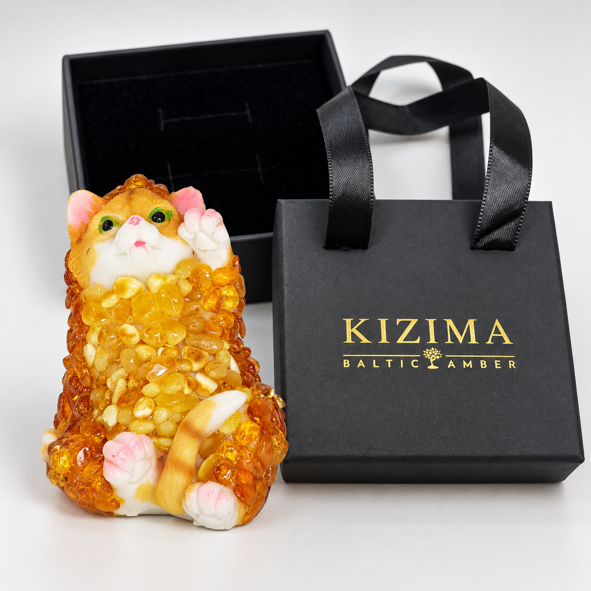 Baltic amber upright cat figurine with black velvet-lined KIZIMA® gift box and gift bag — ready-to-give cat lover gift