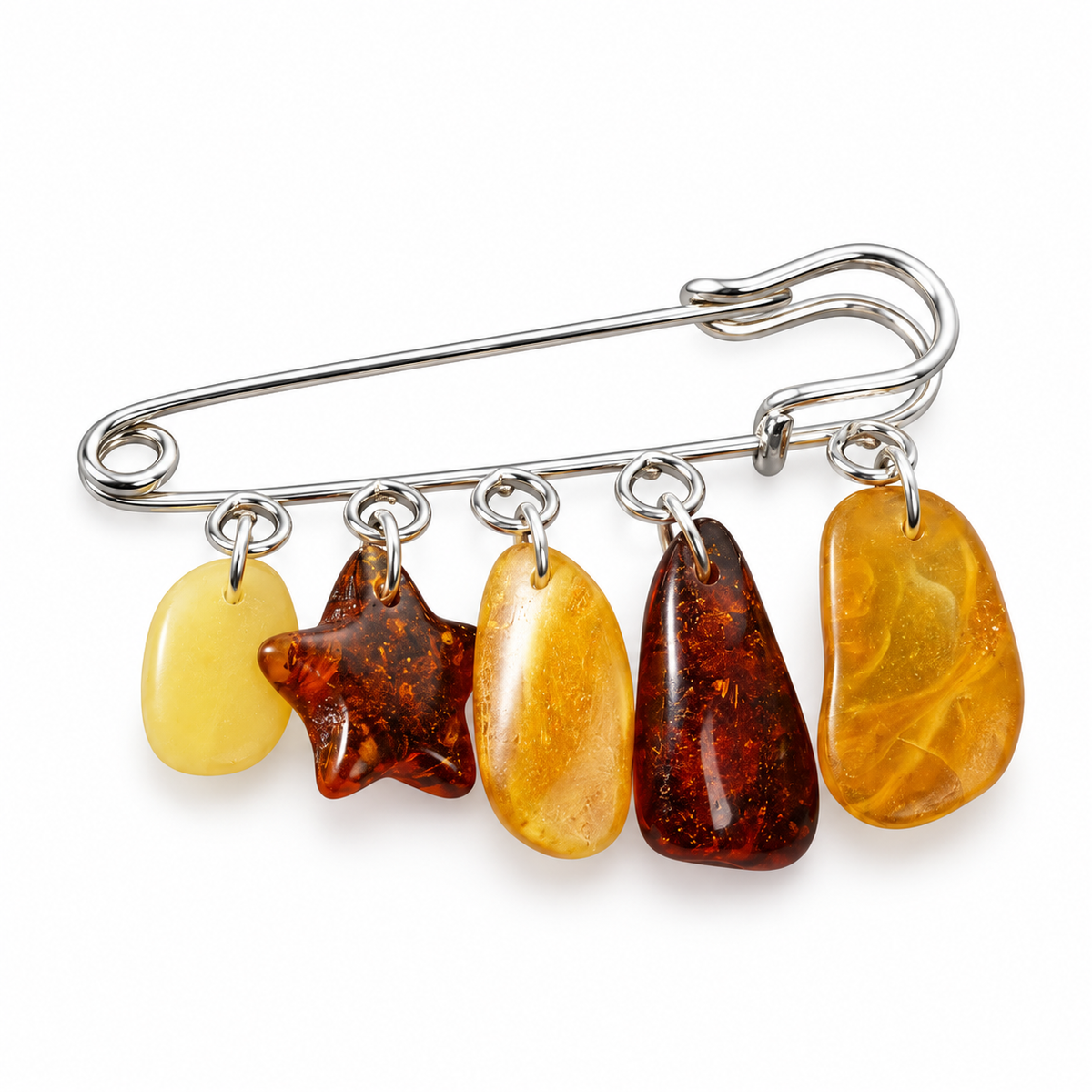 KIZIMA silver-tone safety pin brooch with five distinct yellow, golden and cognac Baltic amber charms on white studio background.