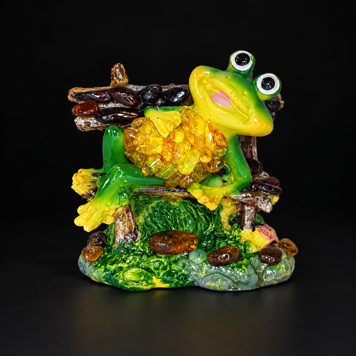 KIZIMA reclining frog figurine 662987478564 with natural amber stones on a premium black studio background.