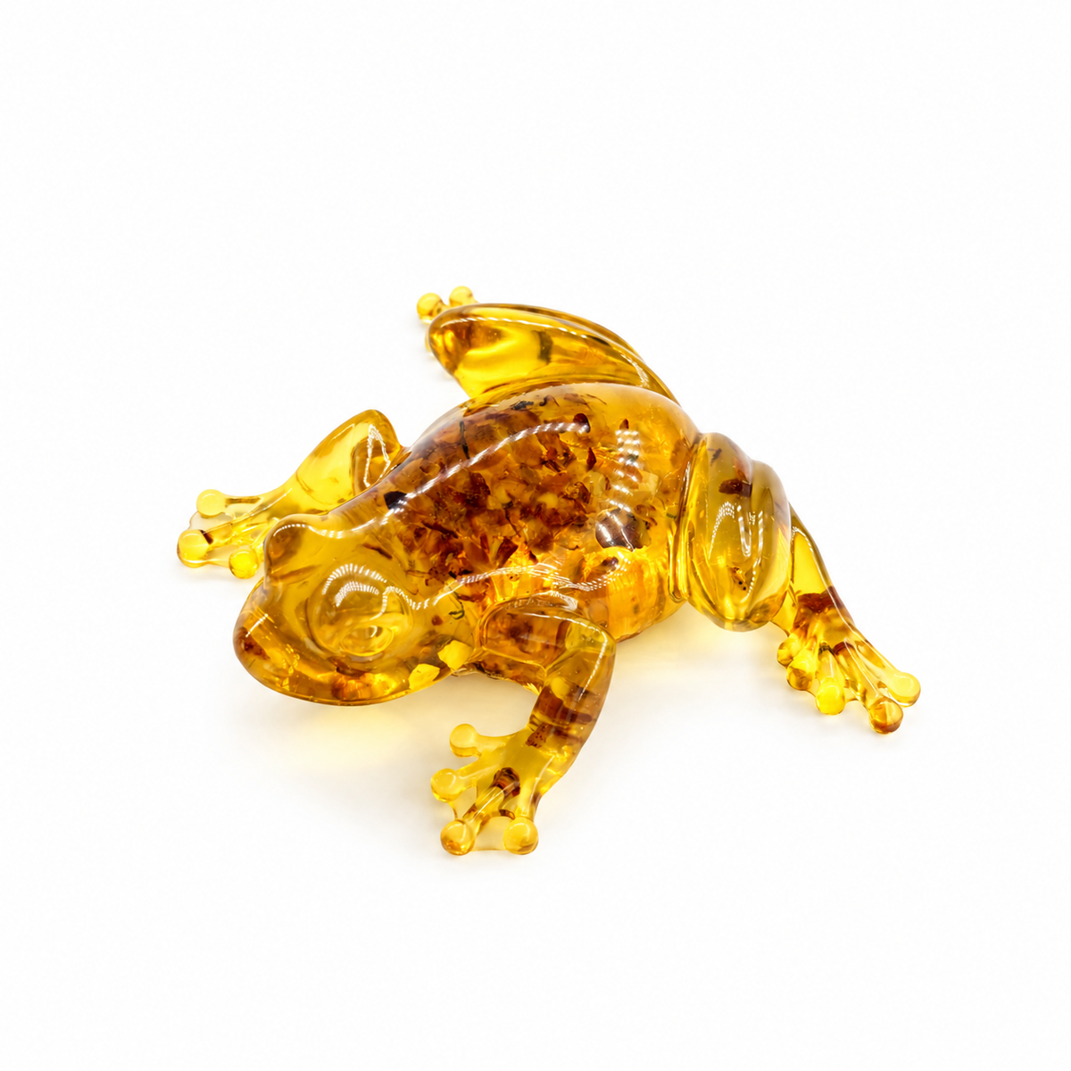 KIZIMA money frog figurine 9K0001q135 in its original crawling pose, showing translucent Baltic amber inclusions against a clean white background.