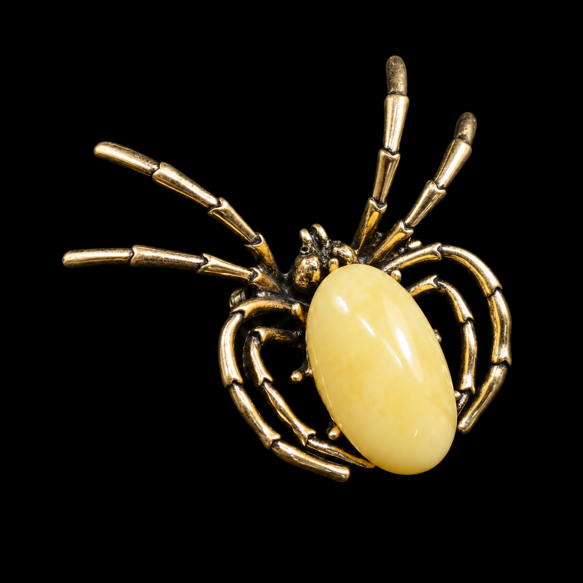 KIZIMA pale opaque yellow amber Gothic spider brooch 20-311Q19-6-6-2, black studio background.