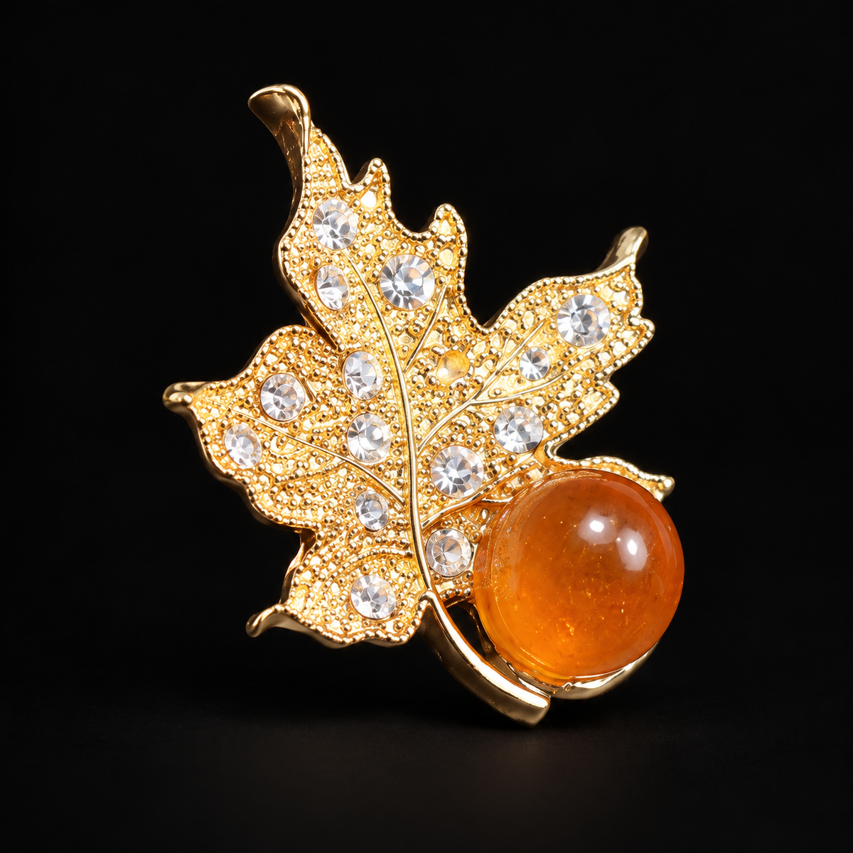 KIZIMA Gold leaf brooch 20-101Q6-3-3-1 — black studio background