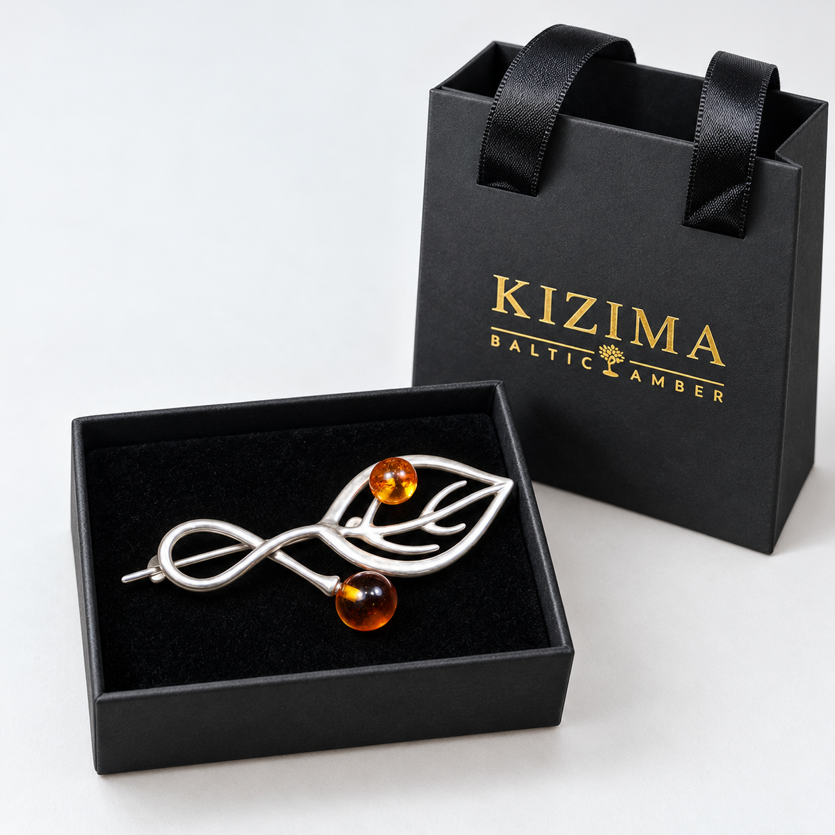 KIZIMA silver-tone openwork leaf and two amber beads brooch 20G0150q3, with actual KIZIMA gift packaging.