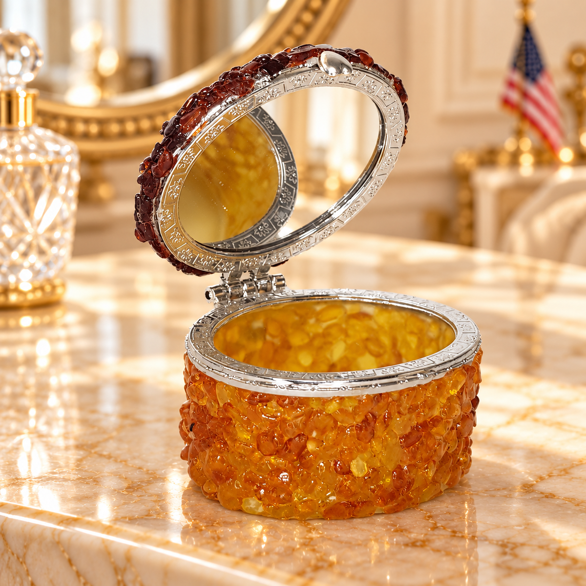 KIZIMA oval Baltic amber jewelry box 5598567 open with mirror on an ivory marble boudoir vanity, warm light and a subtle US flag