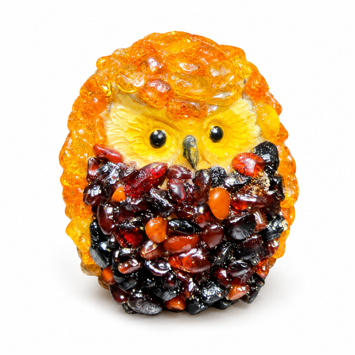 Golden-orange and dark reddish-brown owl figurine on a clean white studio background