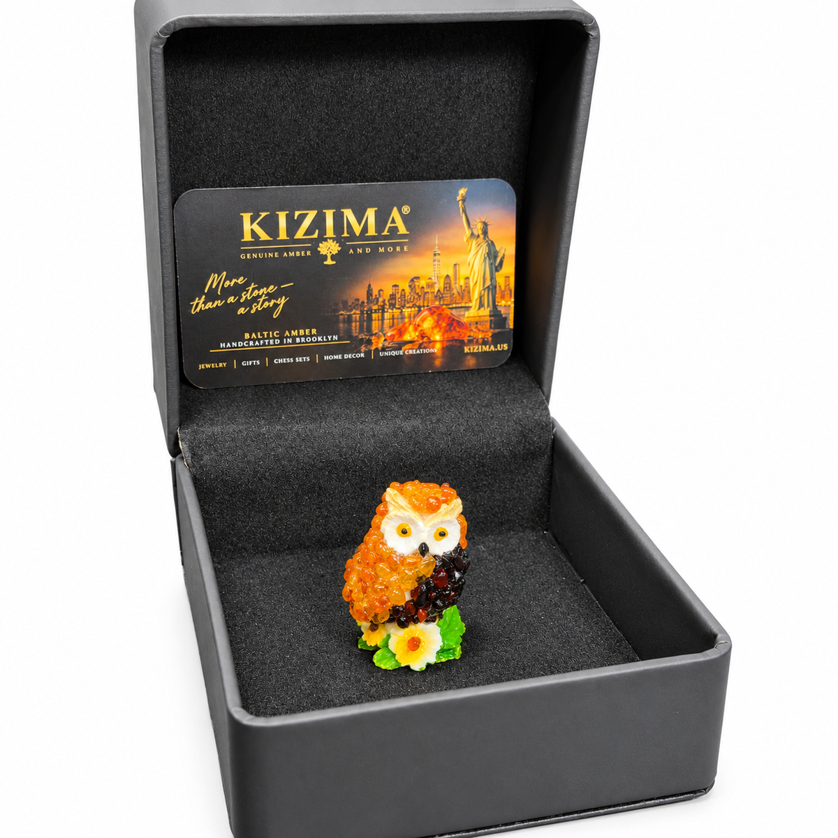 Miniature owl in its original gray KIZIMA presentation box on white background