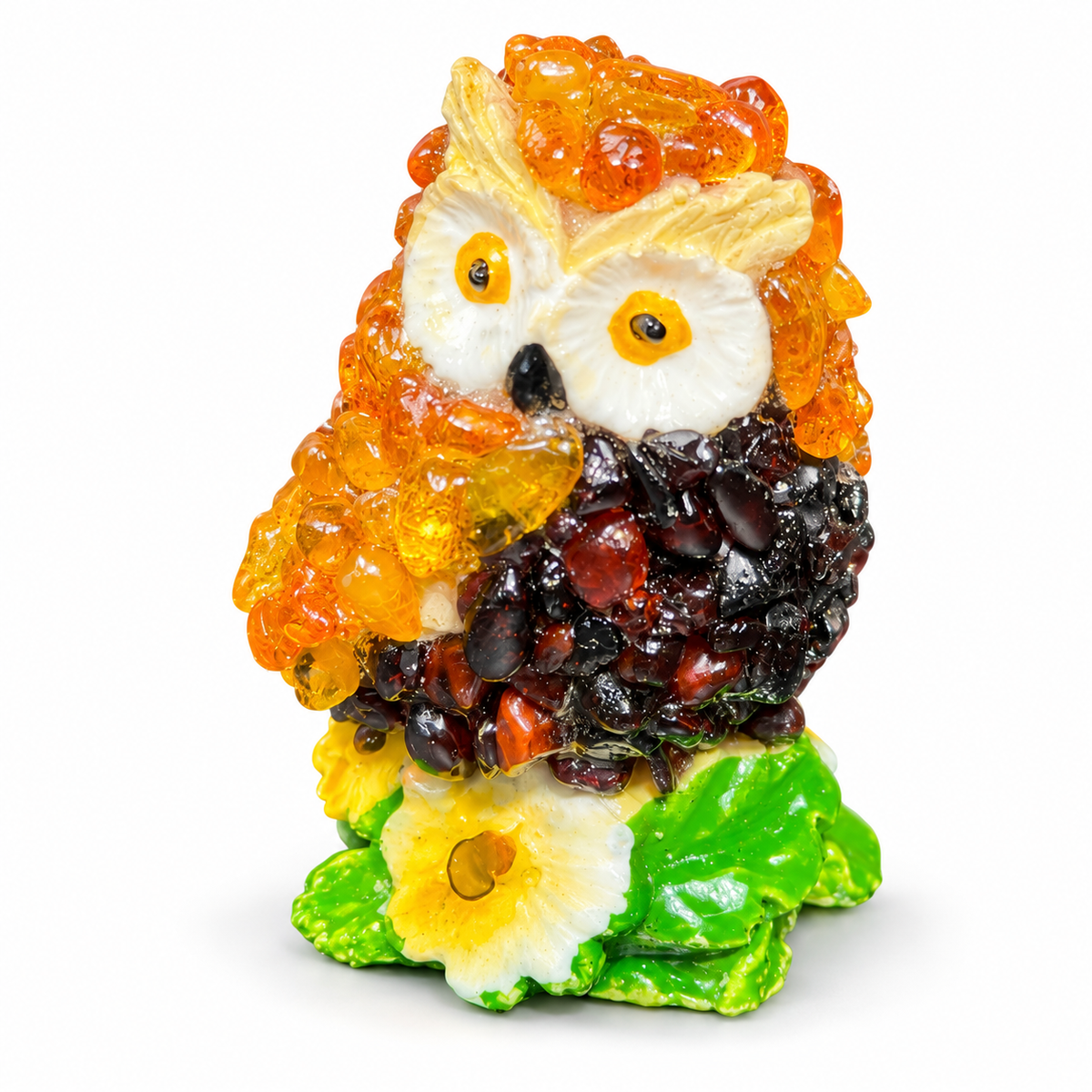Orange and dark brown miniature owl figurine with yellow flower on white background