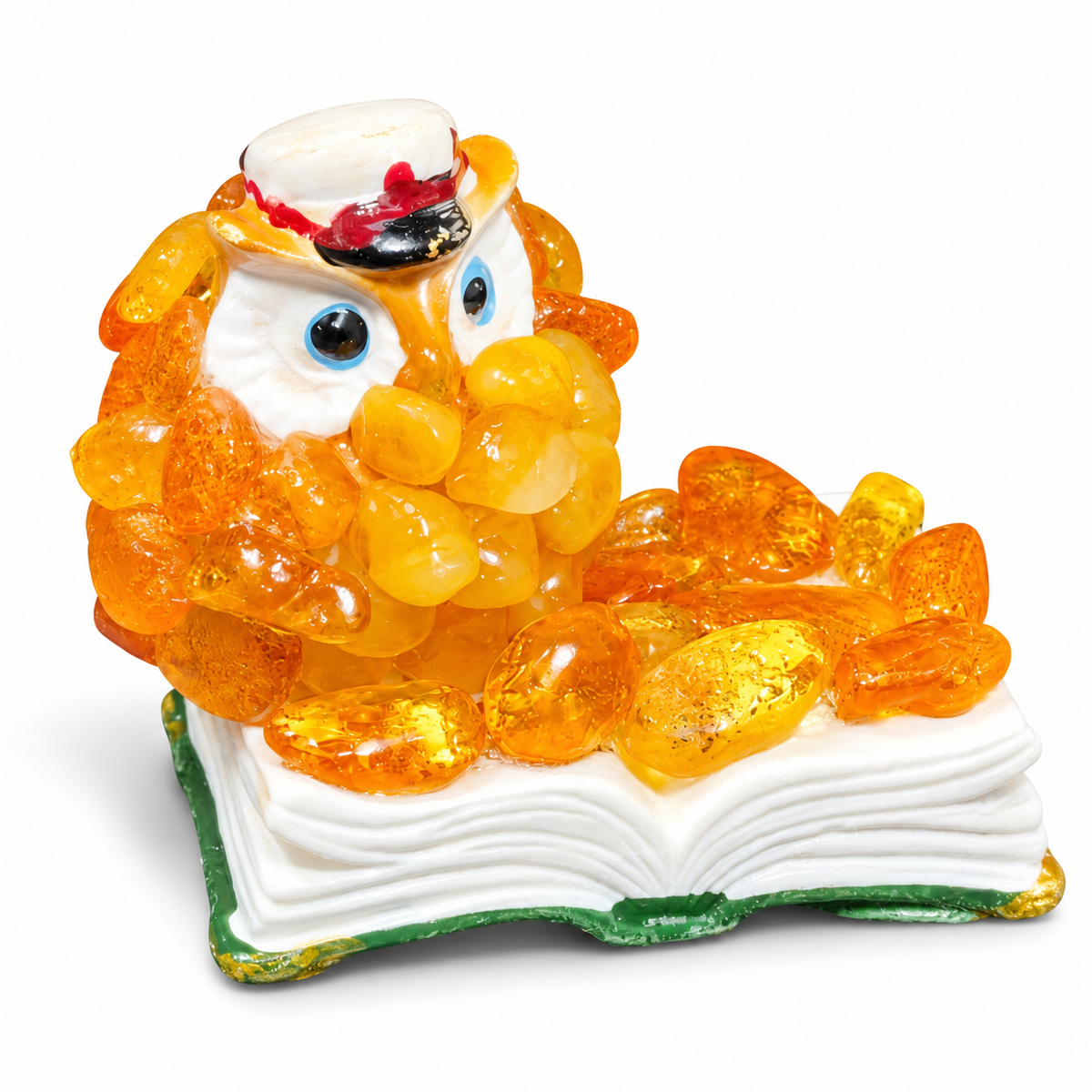 Owl-on-book miniature with orange chips, white pages and green cover on a white background