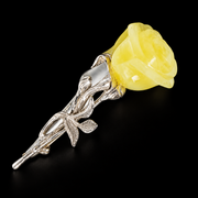 KIZIMA opaque pale yellow amber rose brooch on black studio background.