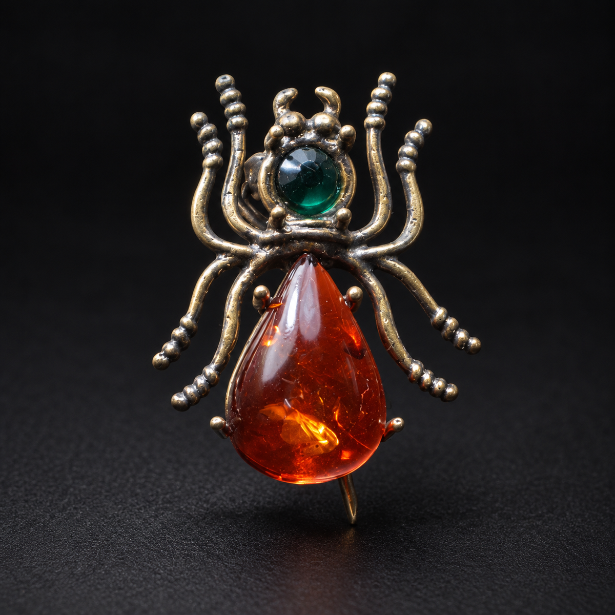 KIZIMA Baltic amber spider brooch 20-312Q4-3-2-1 — black studio background