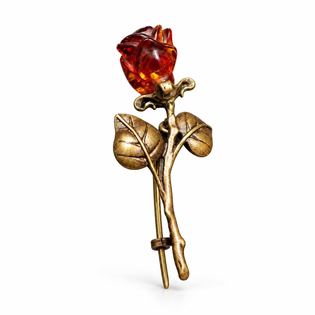 KIZIMA antique bronze-tone rose brooch with a deep cognac amber bud and two rounded leaves on a white studio background.