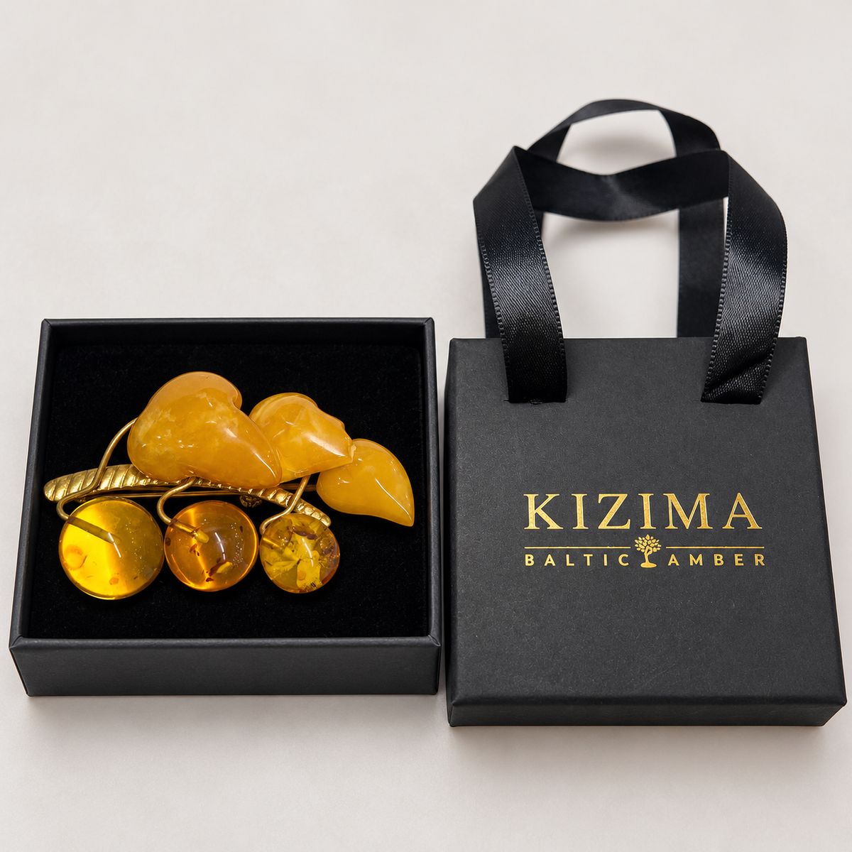 KIZIMA vintage butterscotch amber leaves and honey berries brooch 20Broochgold-2, with actual KIZIMA gift packaging.