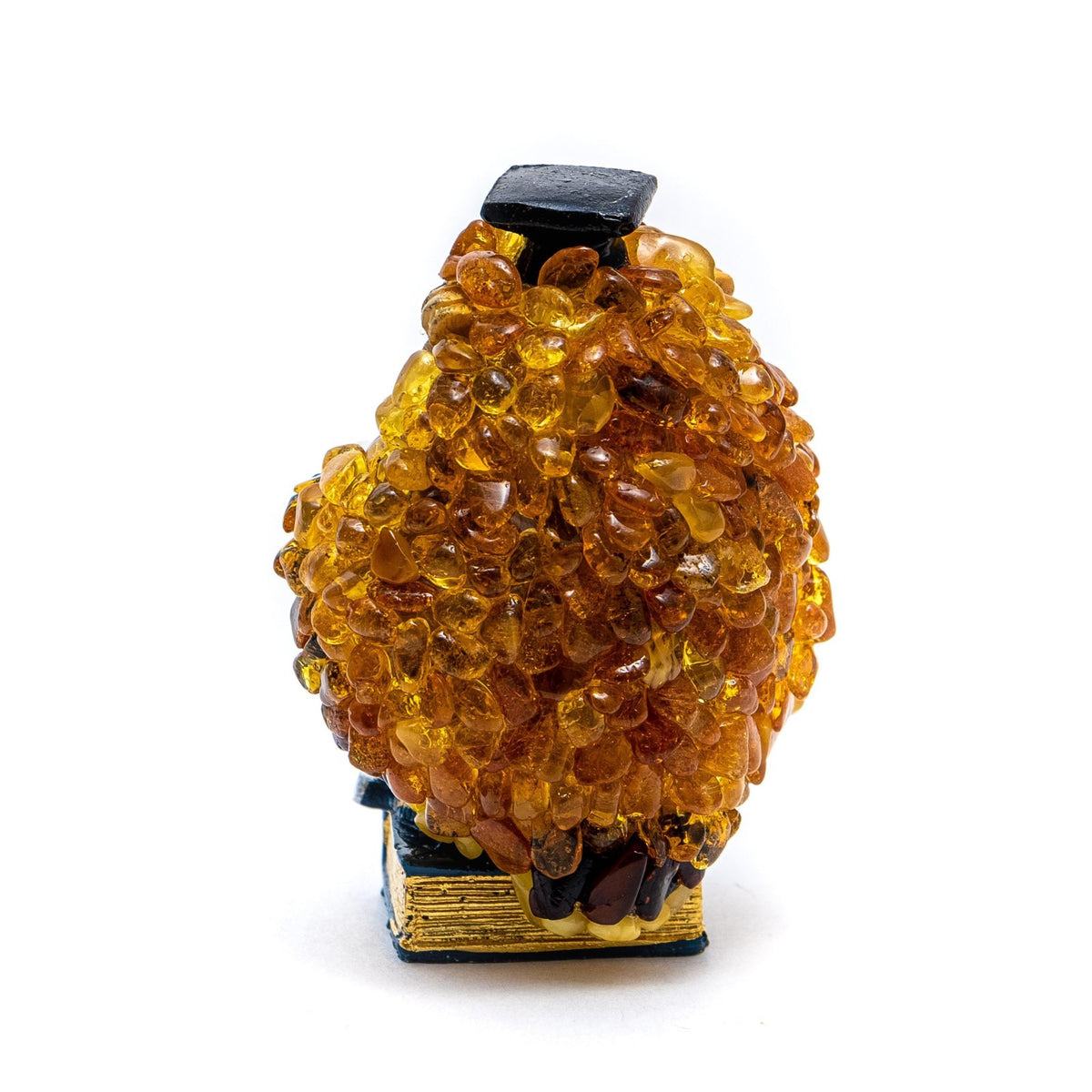 Side view of the Baltic amber mosaic owl office sculpture, handmade in Brooklyn New York.
