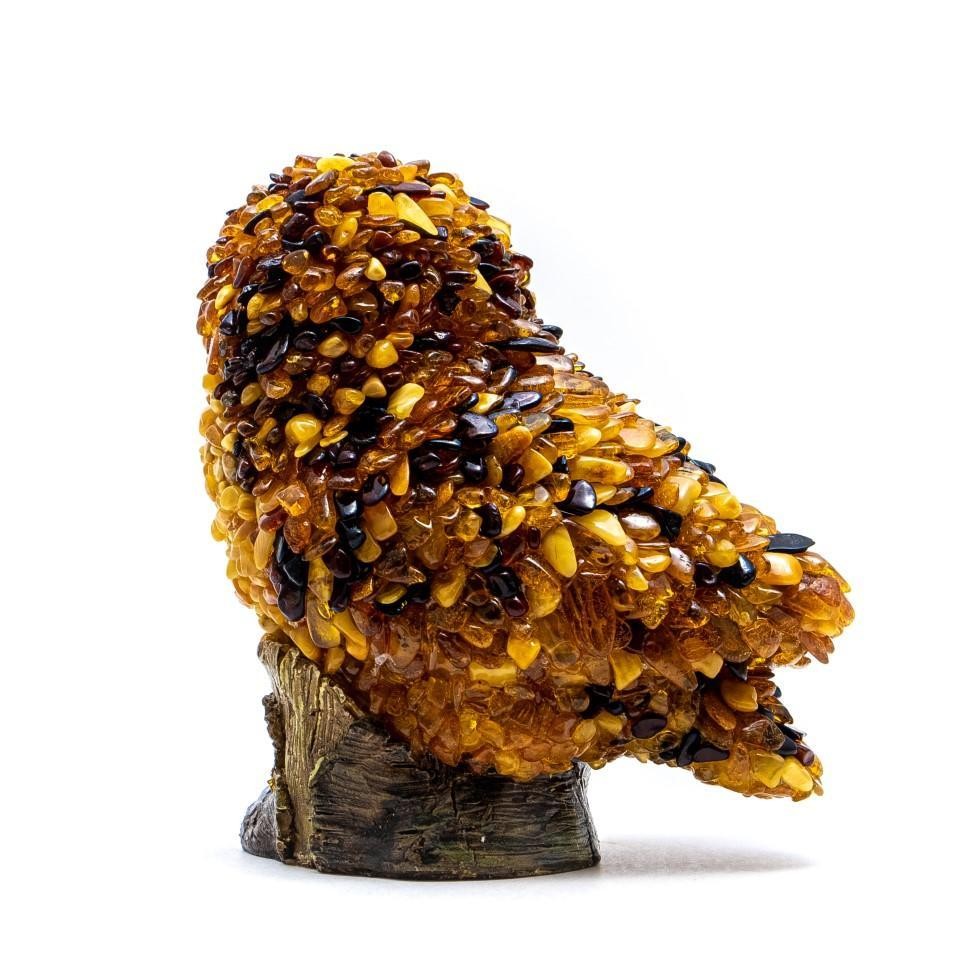 Side view of the hand-laid Baltic amber mosaic wise owl figurine, made in USA by KIZIMA.