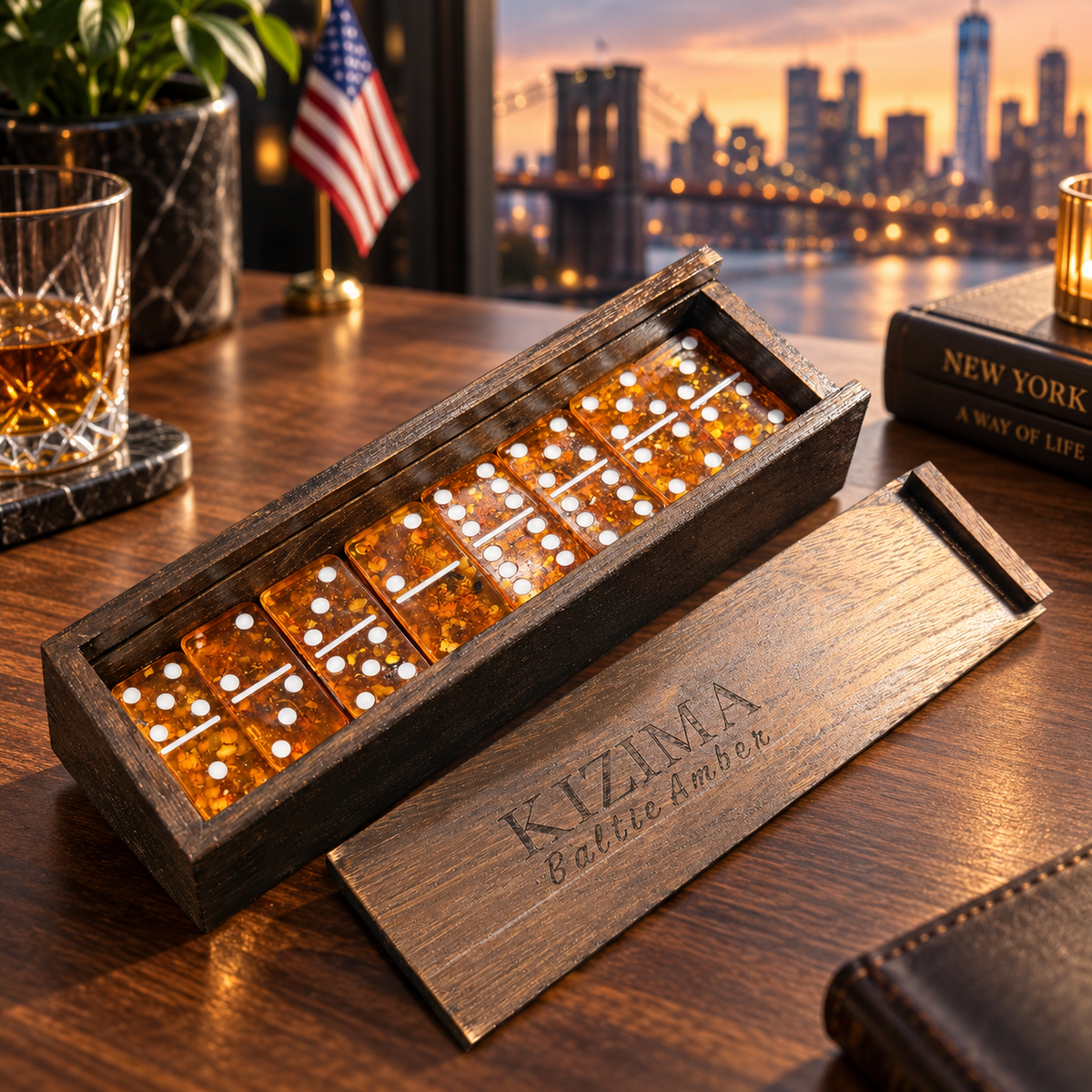 Cherry Natural Baltic Amber domino set on a desk with whiskey and the New York skyline — luxury gift for him handmade in Brooklyn by KIZIMA®
