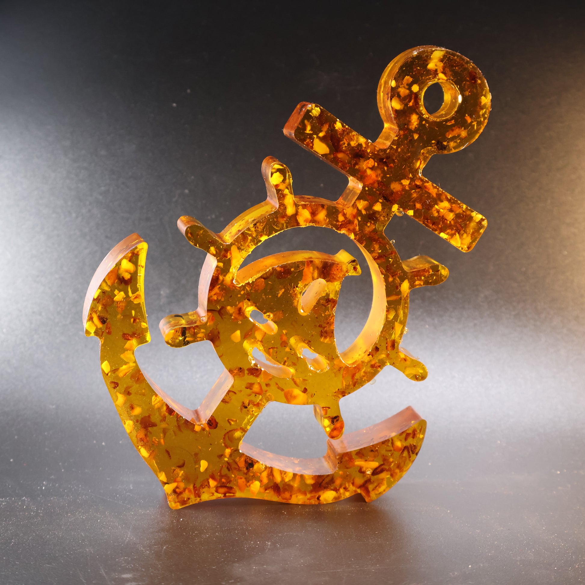 Genuine Baltic amber anchor and wheel plaque angled view