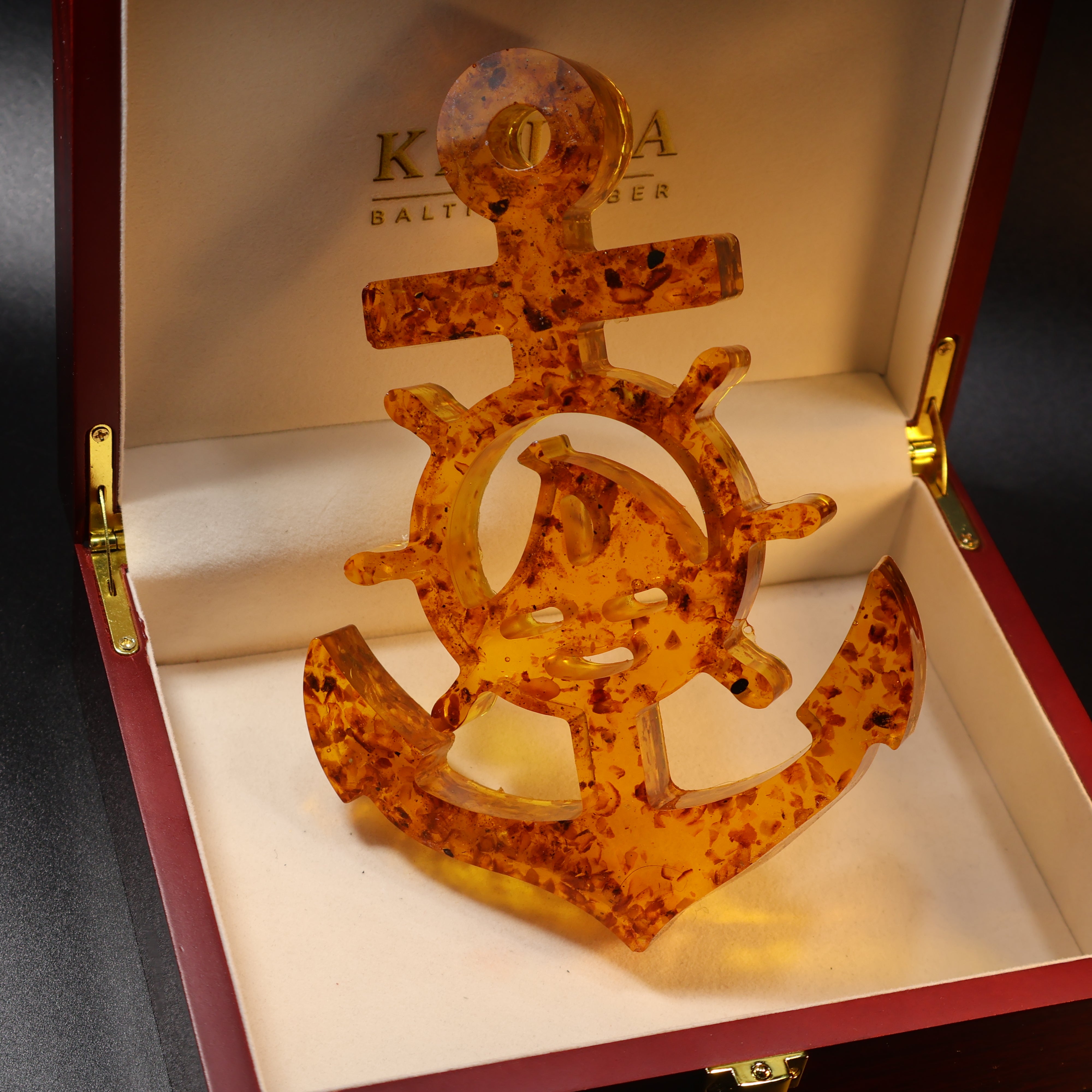 Baltic amber anchor and ships wheel plaque scale reference photo