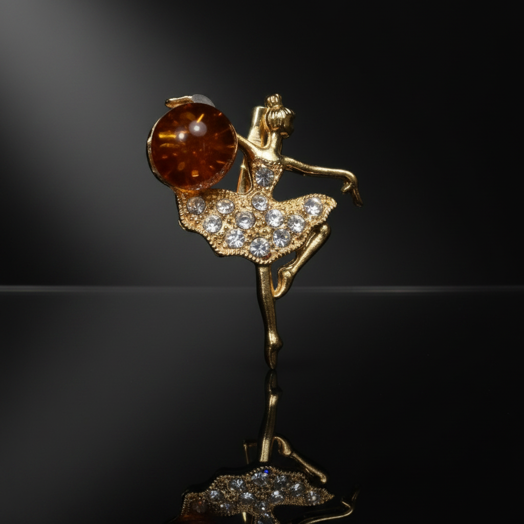 Made in USA genuine natural Baltic amber ballerina brooch by KIZIMA on glossy black studio background with reflection, luxury jewelry photography