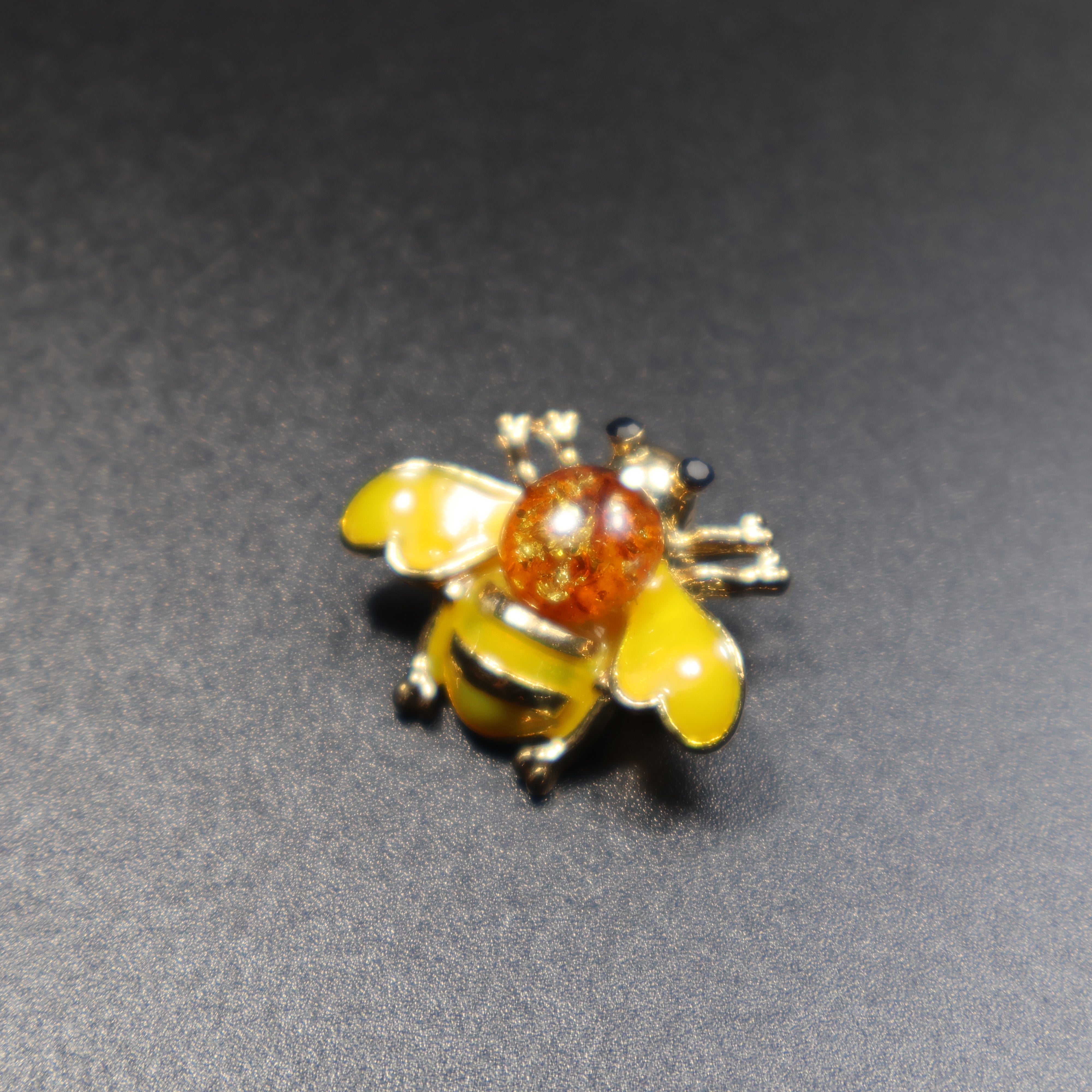 Baltic amber bee brooch black variant close-up