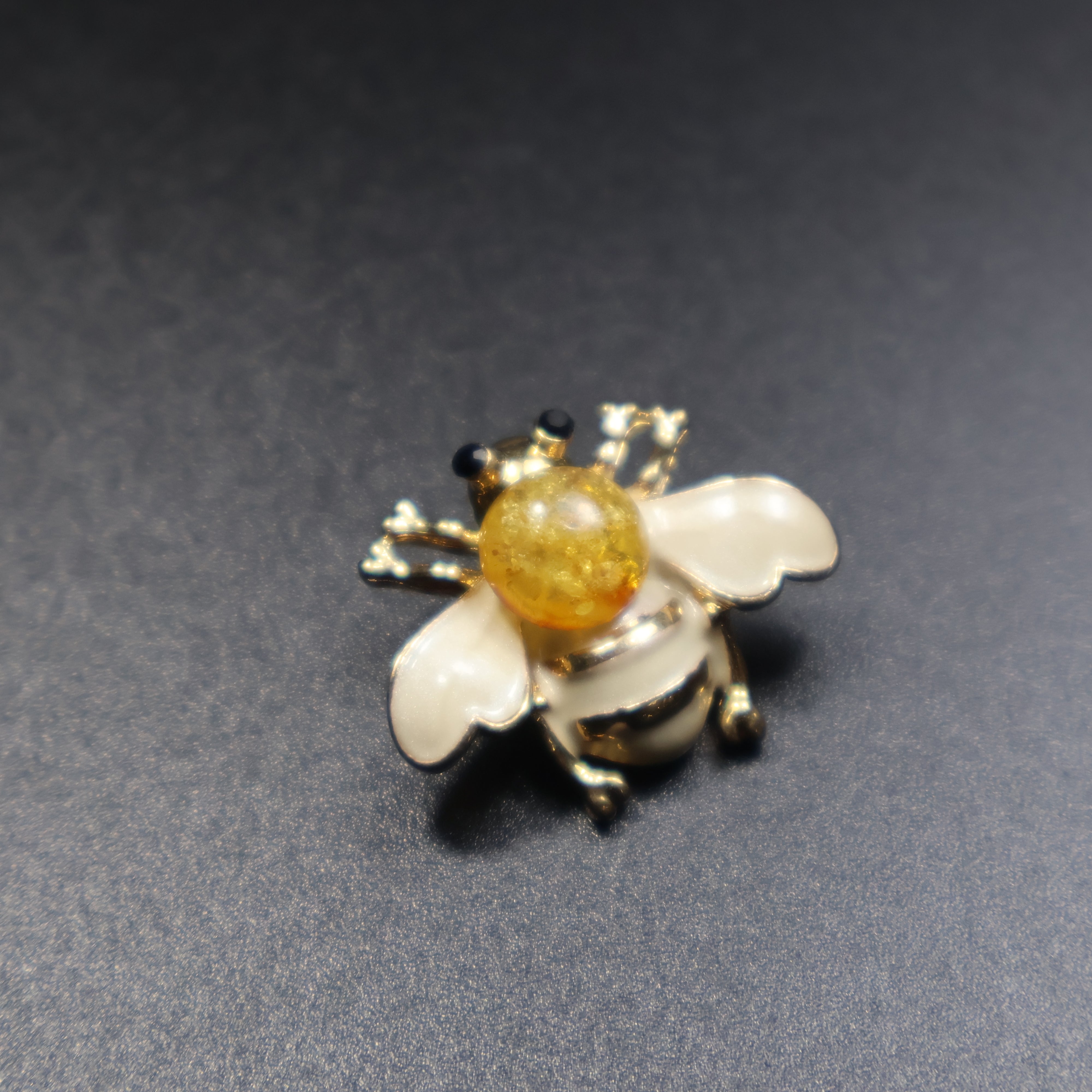 Baltic amber bee brooch green variant close-up