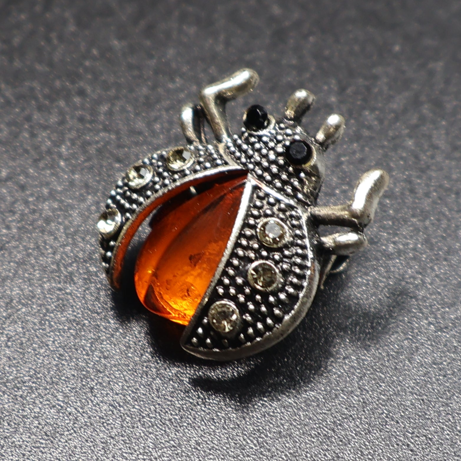 Handmade Baltic amber beetle pin close-up additional view