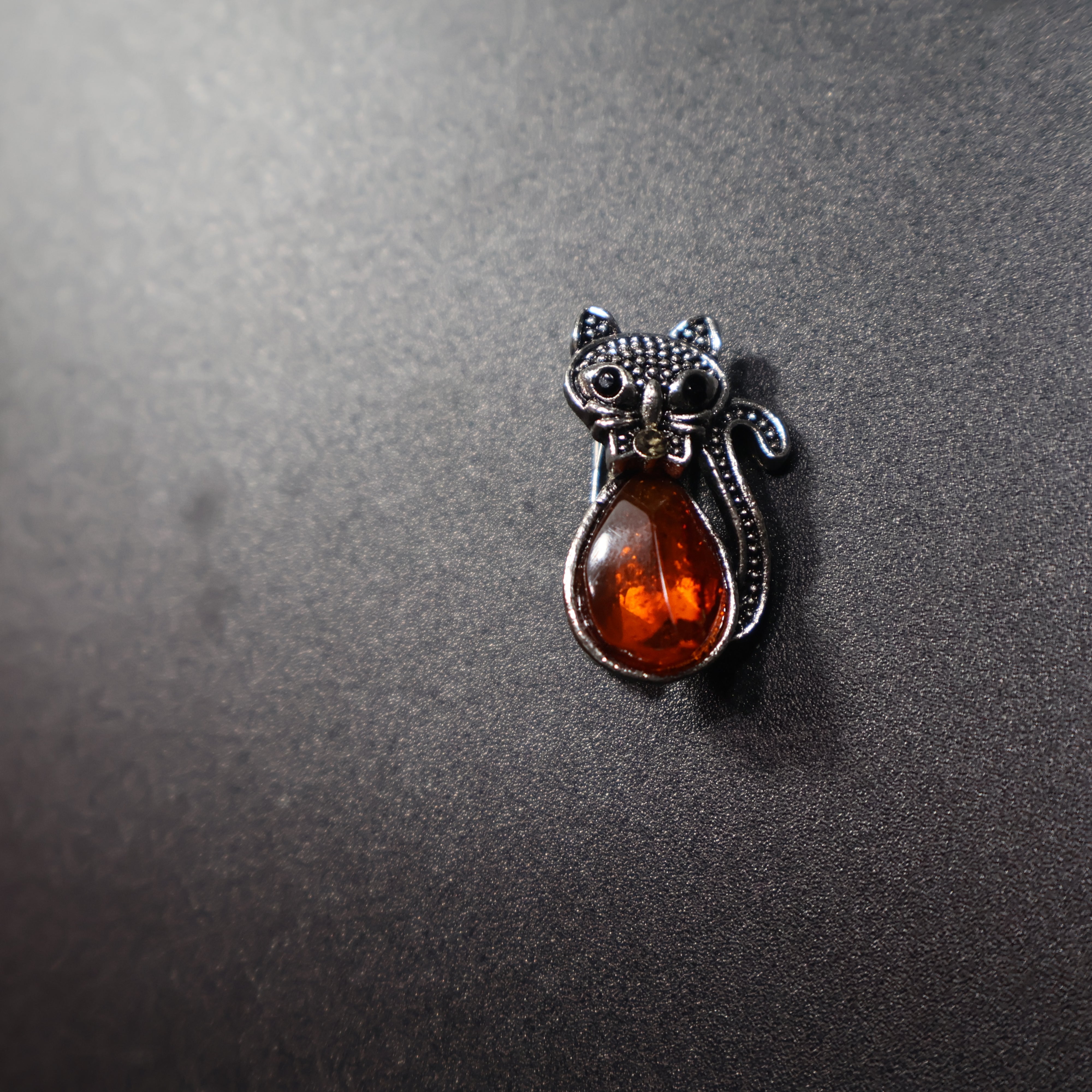Amber black cat brooch gold scale reference photo