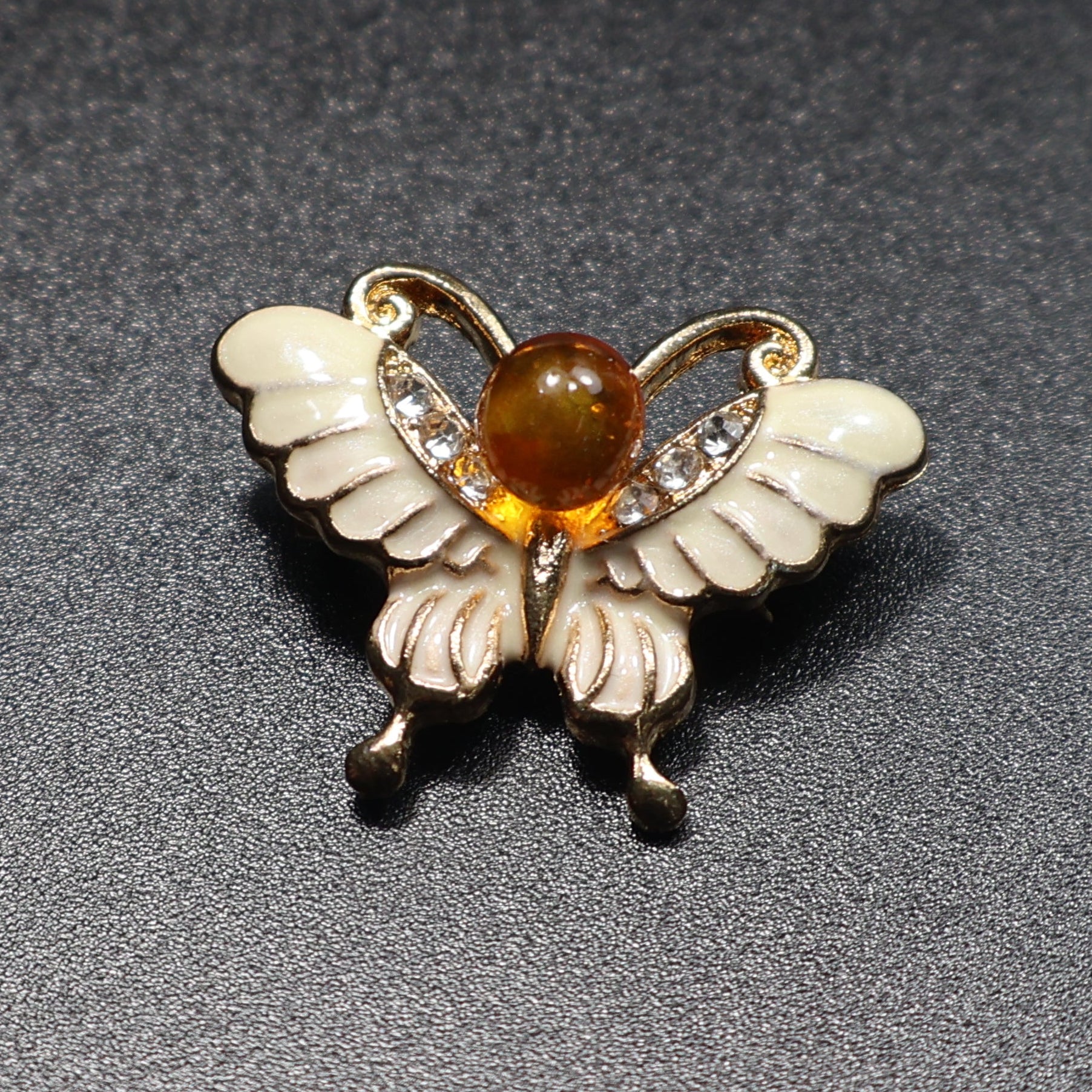 Handmade Baltic amber butterfly brooch red variant close-up