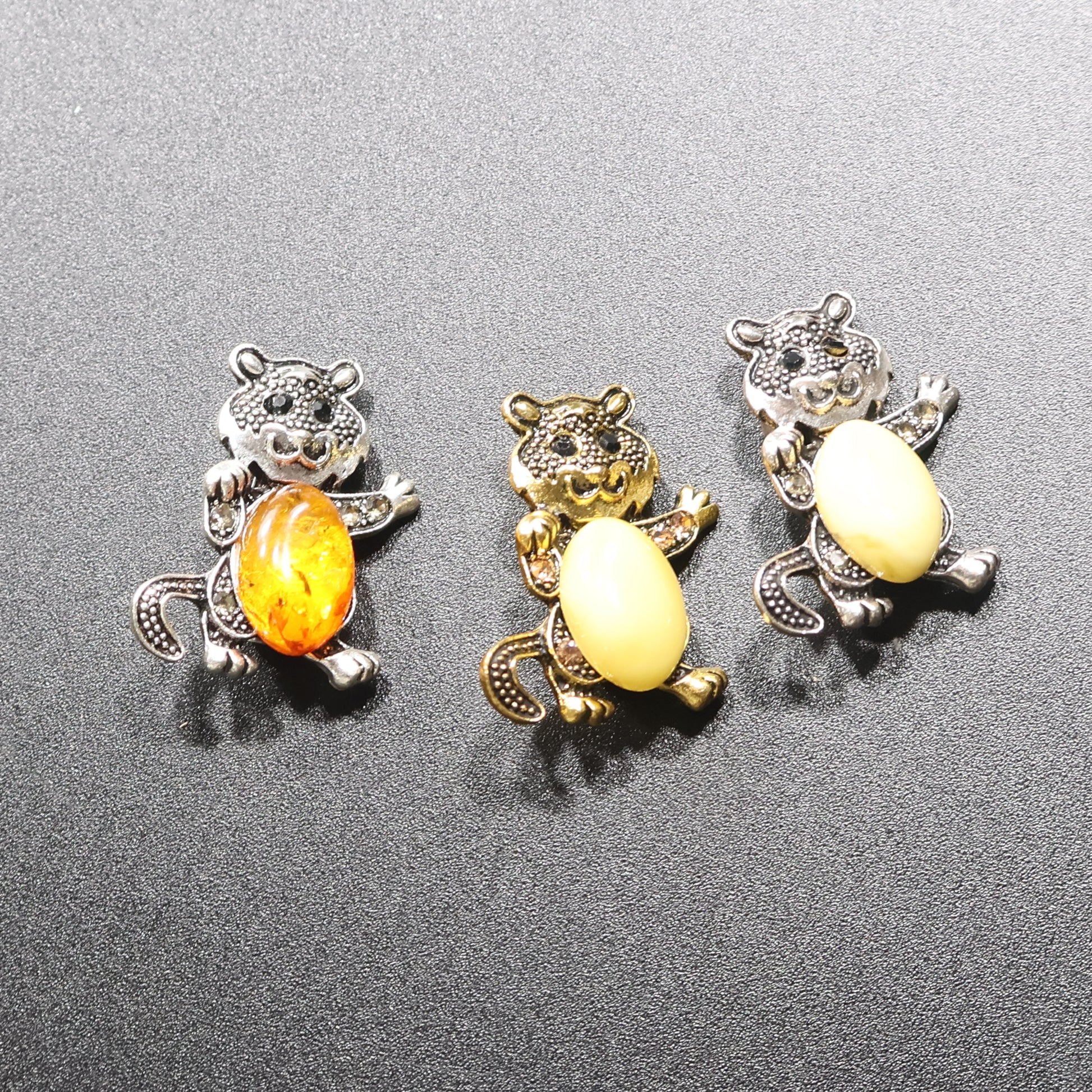 Genuine Baltic amber cat brooch silver amber tail down front view