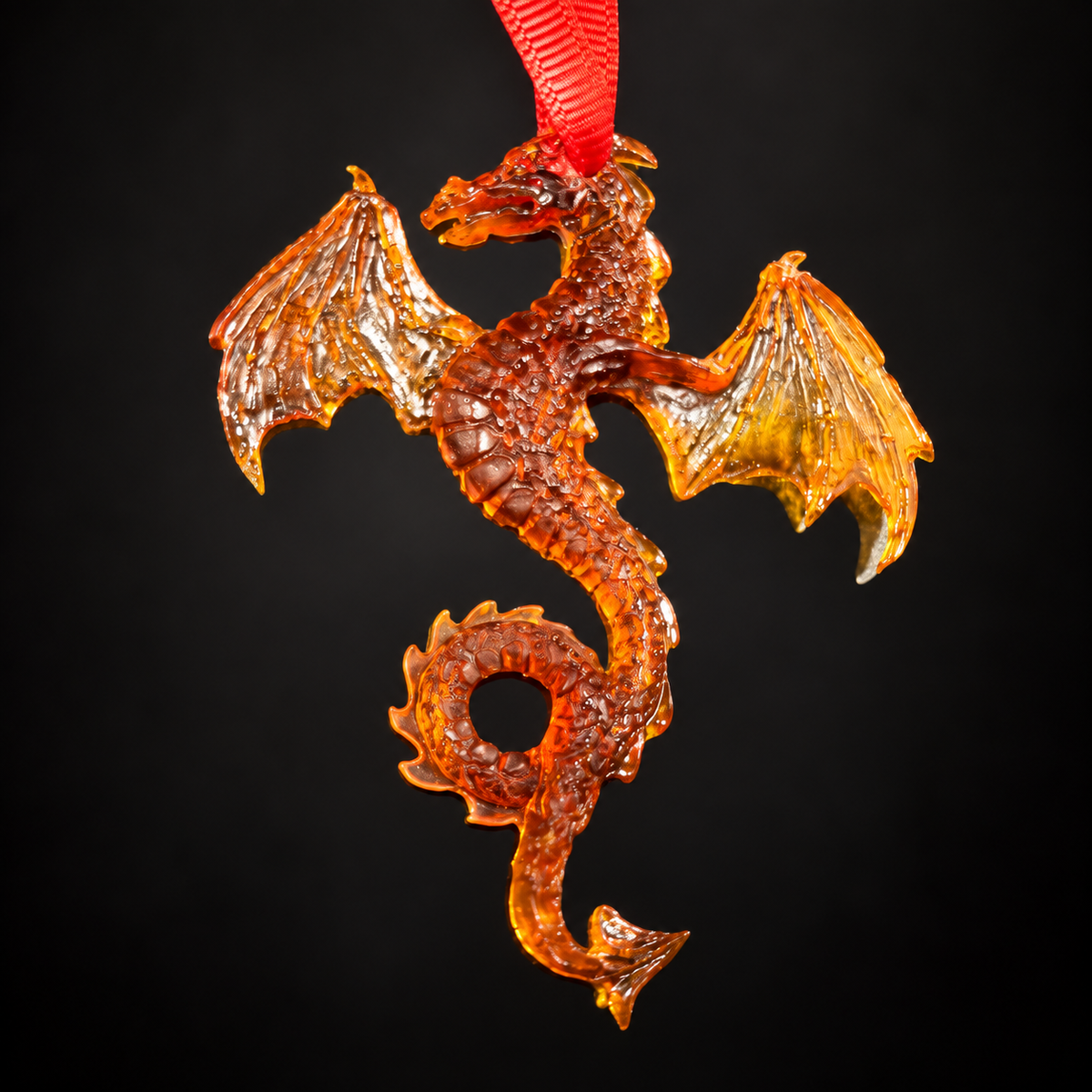 Genuine Baltic amber dragon keychain on black studio background — handmade car charm by KIZIMA®, Made in USA