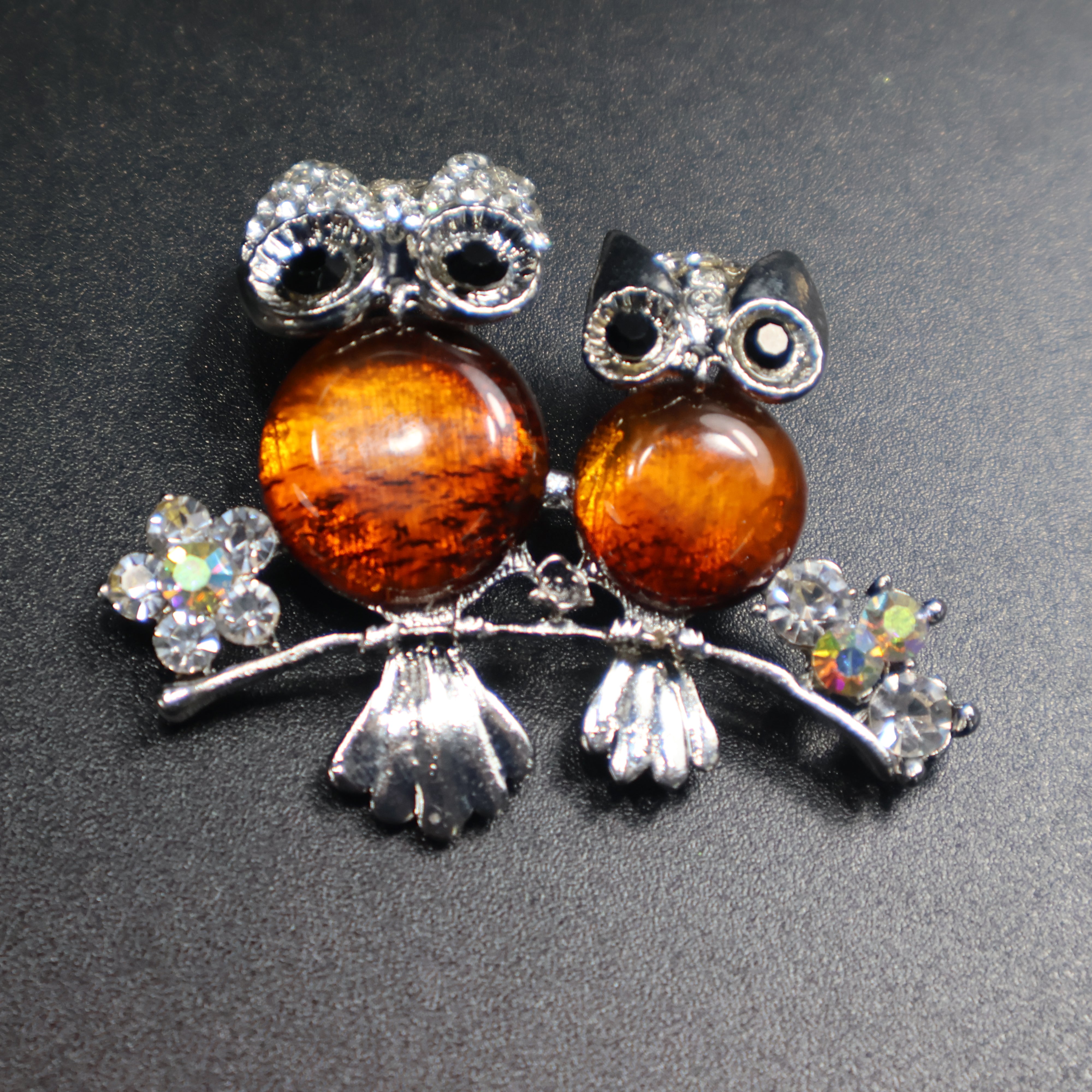 Natural Baltic amber owl brooch top view close-up