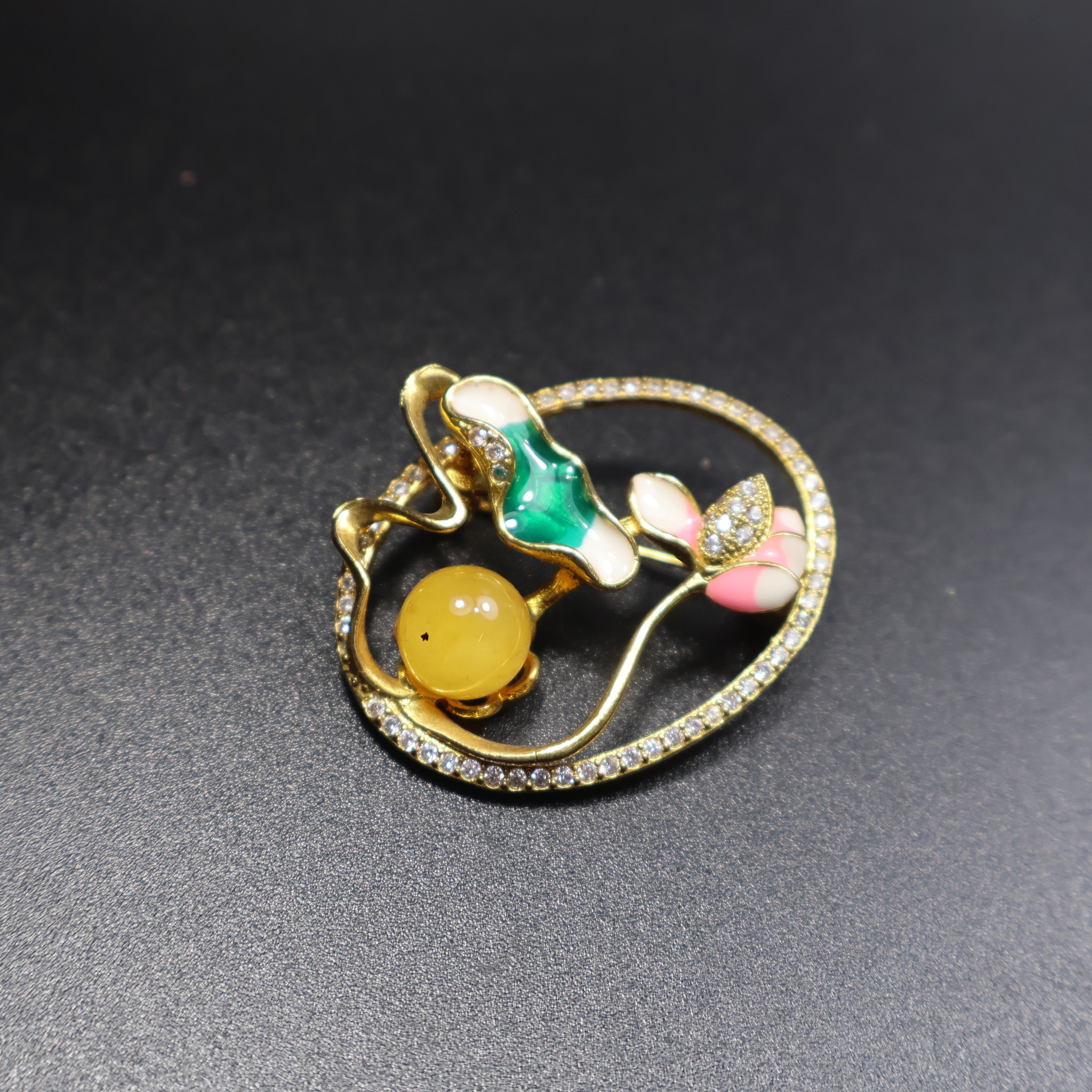 Handmade Baltic amber brooch close-up showing natural stone clarity