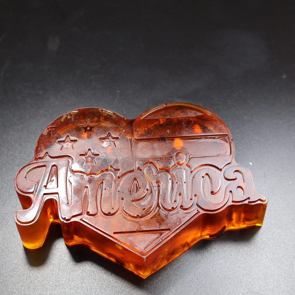 KIZIMA® Natural Baltic Amber America heart, patriotic amber desk decor Made in USA — angled view