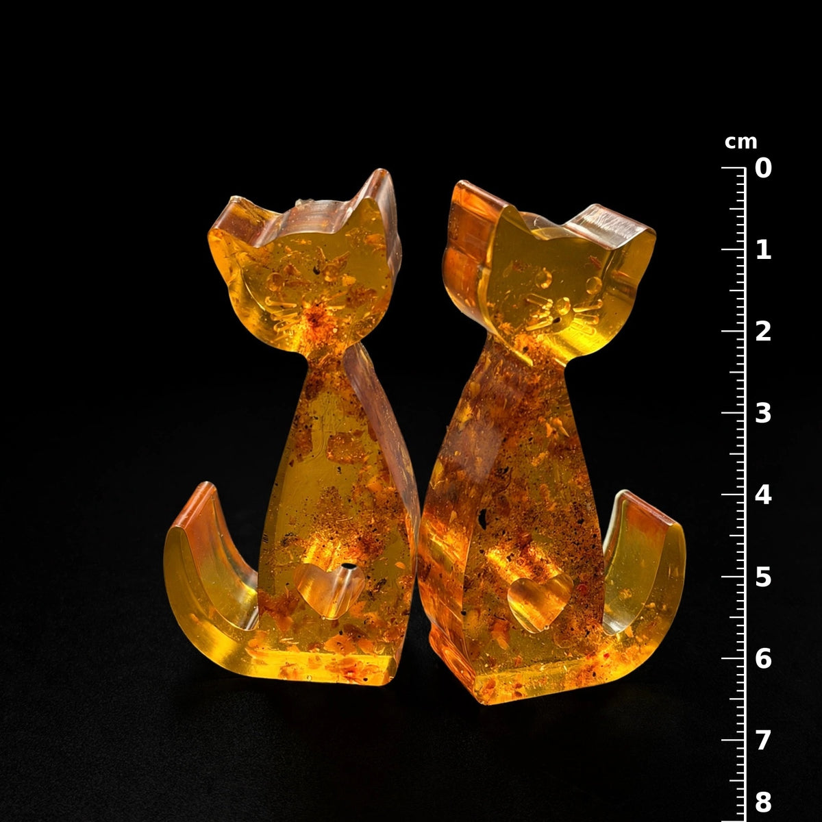 Baltic amber cat figurines with centimeter ruler showing 8 cm height, handmade in USA by KIZIMA