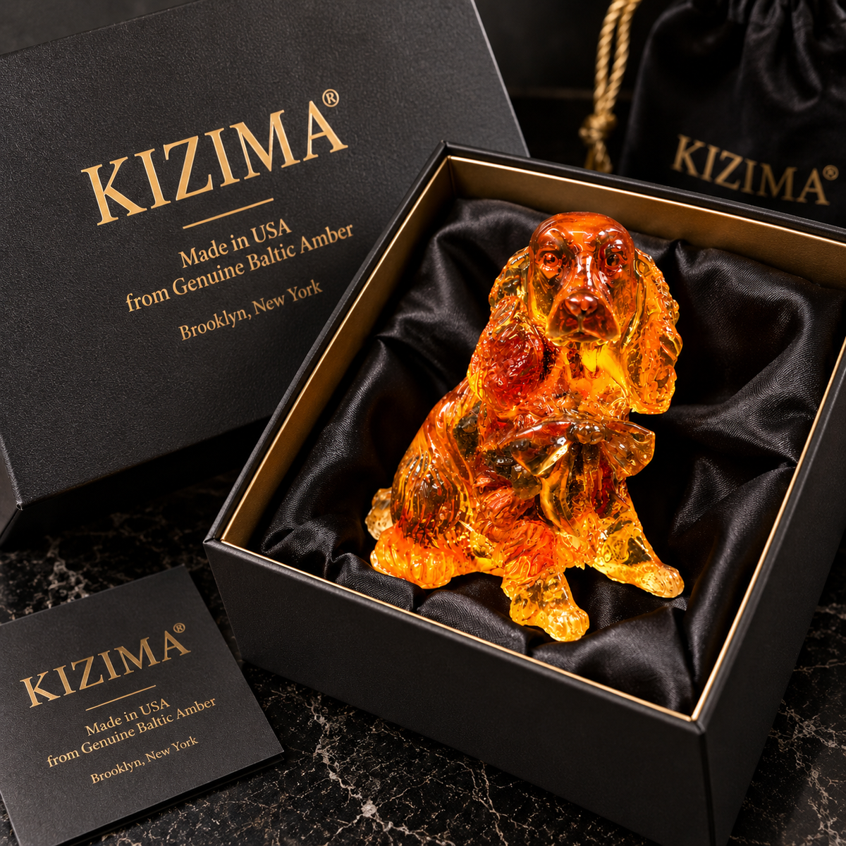 Made in USA natural Baltic amber Cocker Spaniel figurine in black KIZIMA® gift box with velvet pouch — ready-to-give spaniel lover gift
