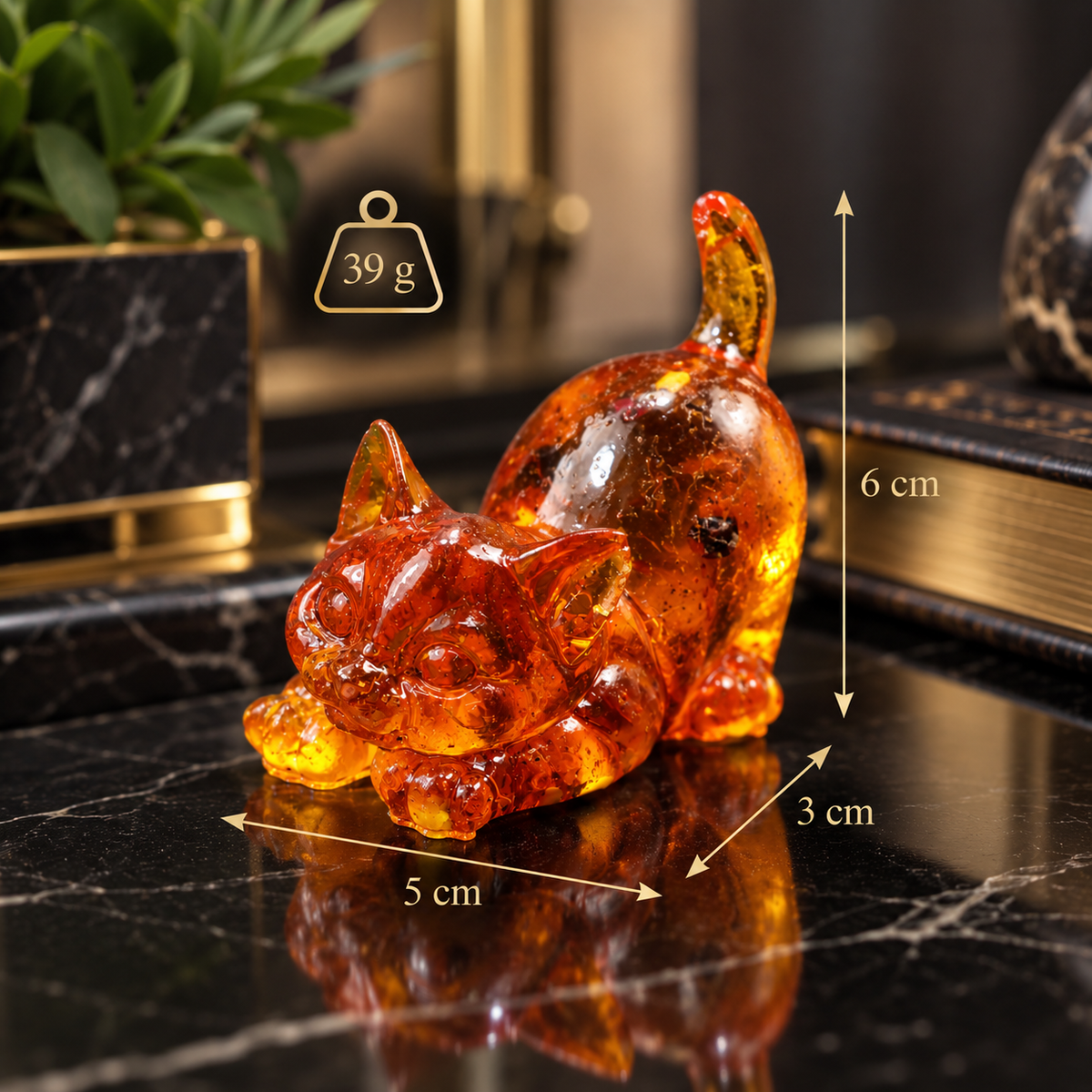 Baltic amber golden cat figurine size chart on marble desk: 6 cm tall, 5 x 3 cm, 39 g — handcrafted in USA by KIZIMA®