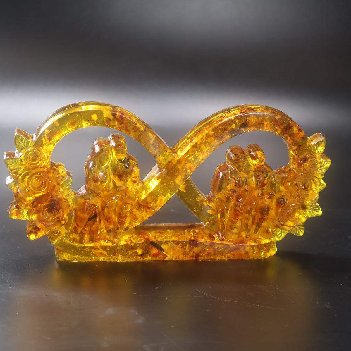 Infinity symbol in cognac and honey Baltic amber linking wedding day and old age, handmade in USA by KIZIMA®