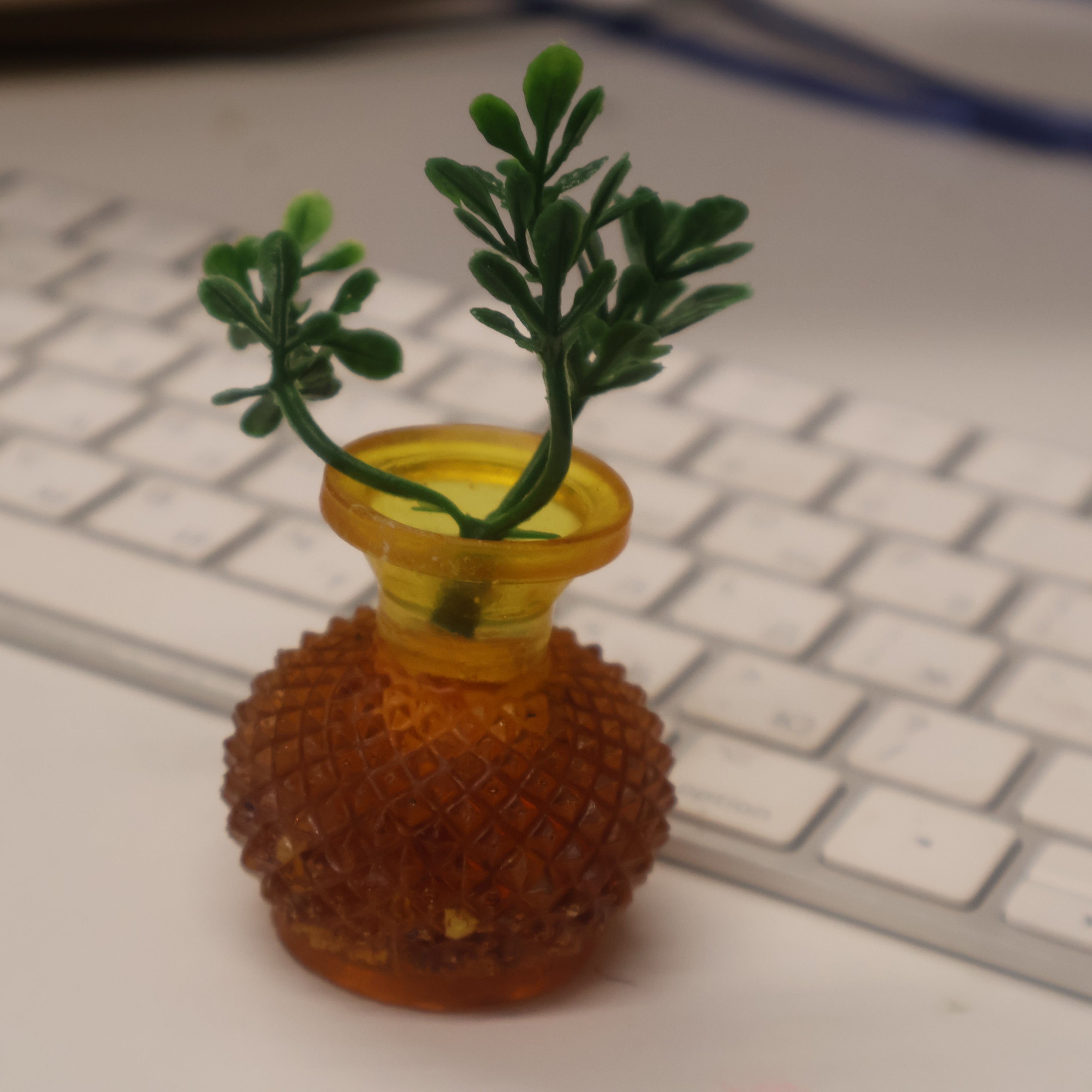 Miniature Baltic amber vase on office desk for size reference — small amber desk decor accent by KIZIMA®