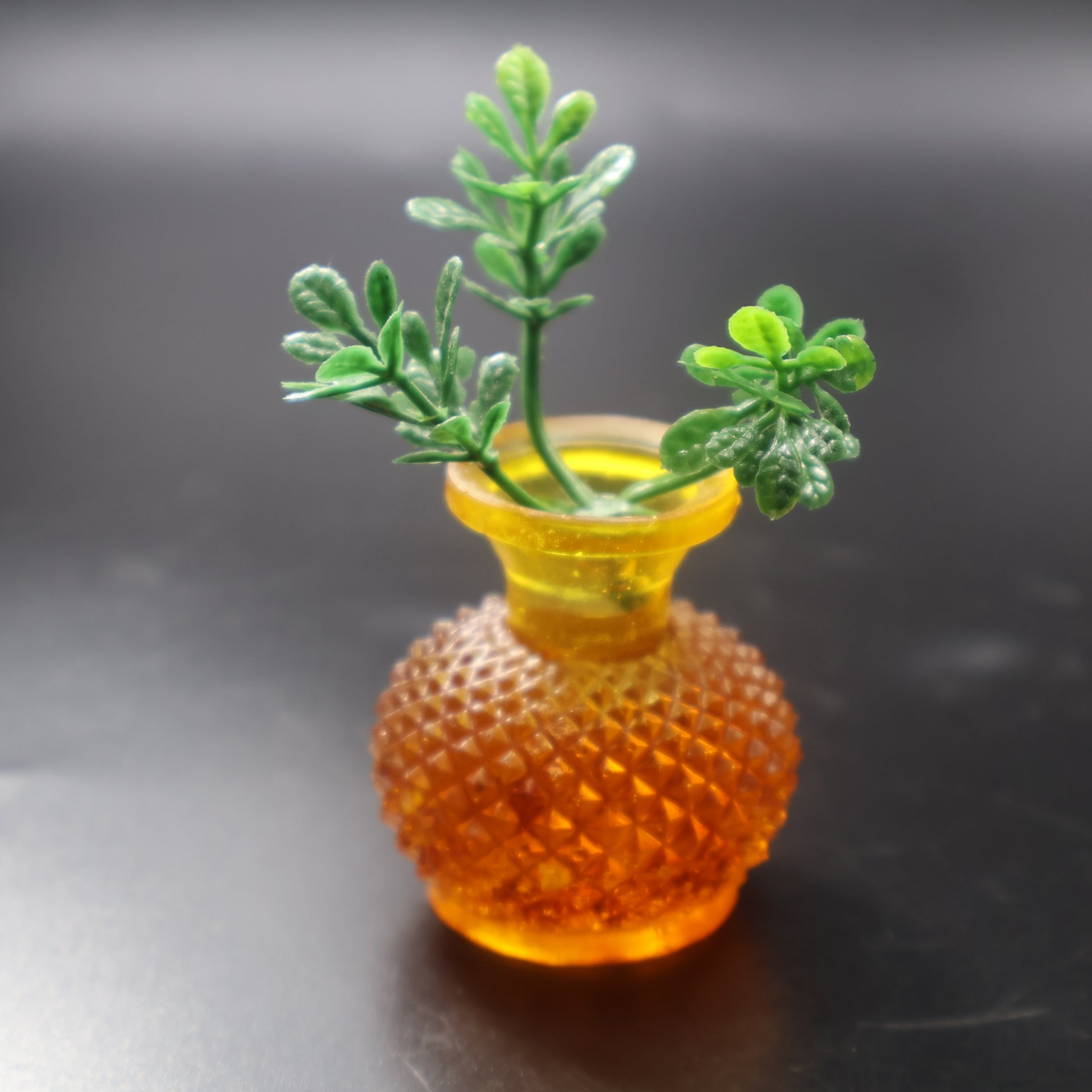 Natural Baltic amber miniature vase with textured diamond pattern, three-quarter view, KIZIMA® handcrafted decor