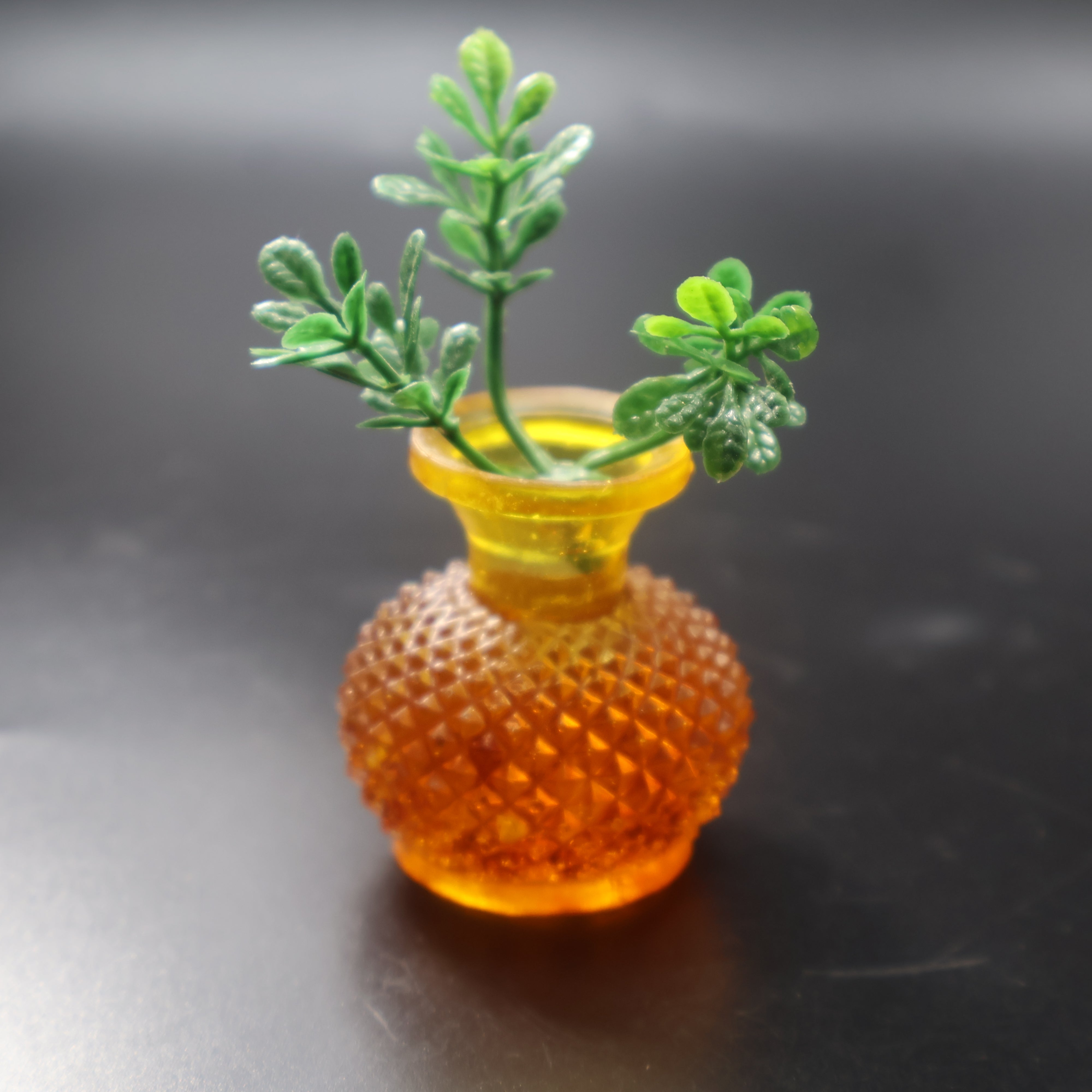 Small Baltic amber vase glowing in honey and cognac colors, top angle view — luxury amber home accent by KIZIMA®