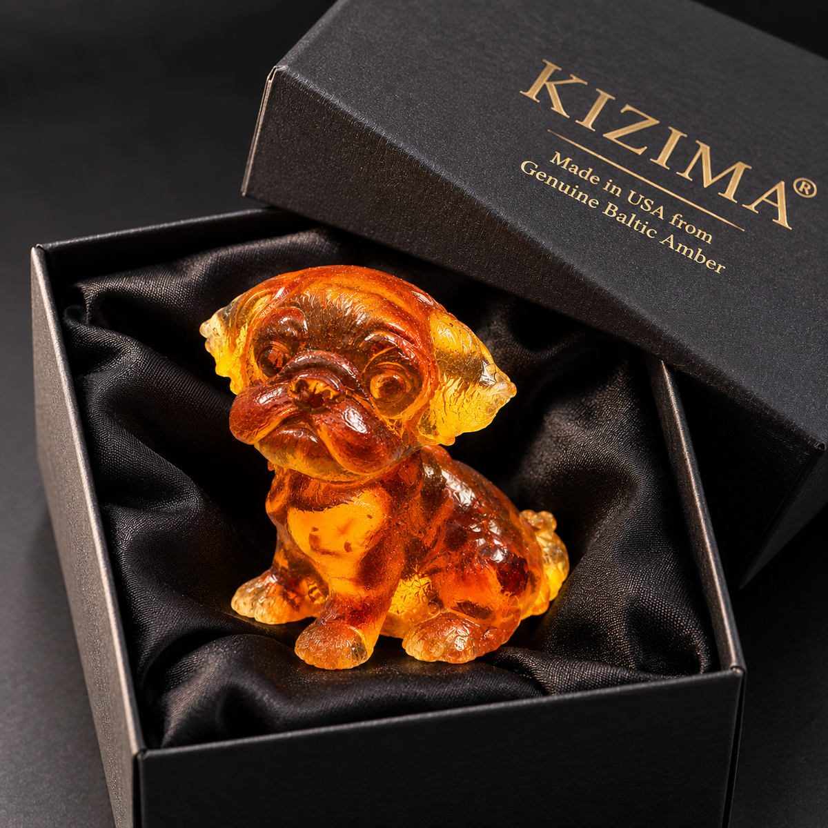 Made in USA natural Baltic amber pug puppy figurine in black KIZIMA® gift box on satin — ready-to-give pug lover gift