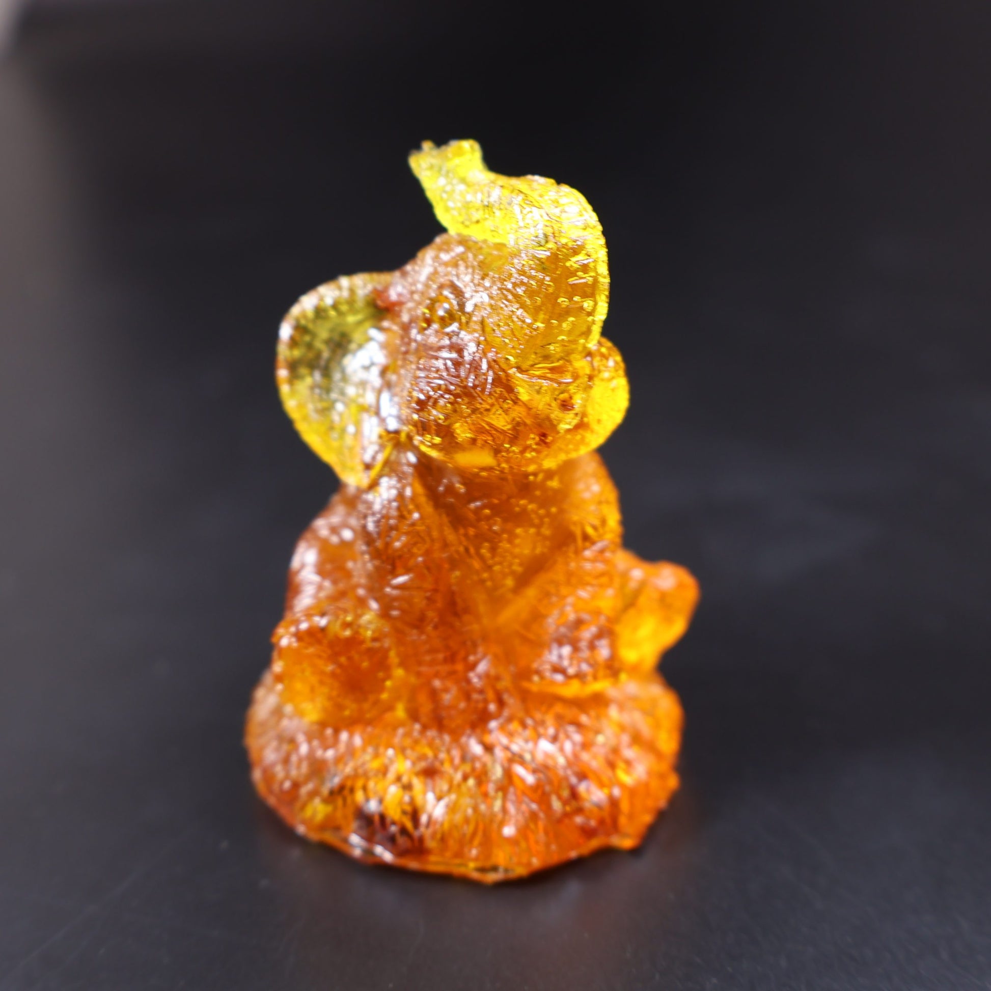 Genuine Baltic amber seated elephant figurine detail view
