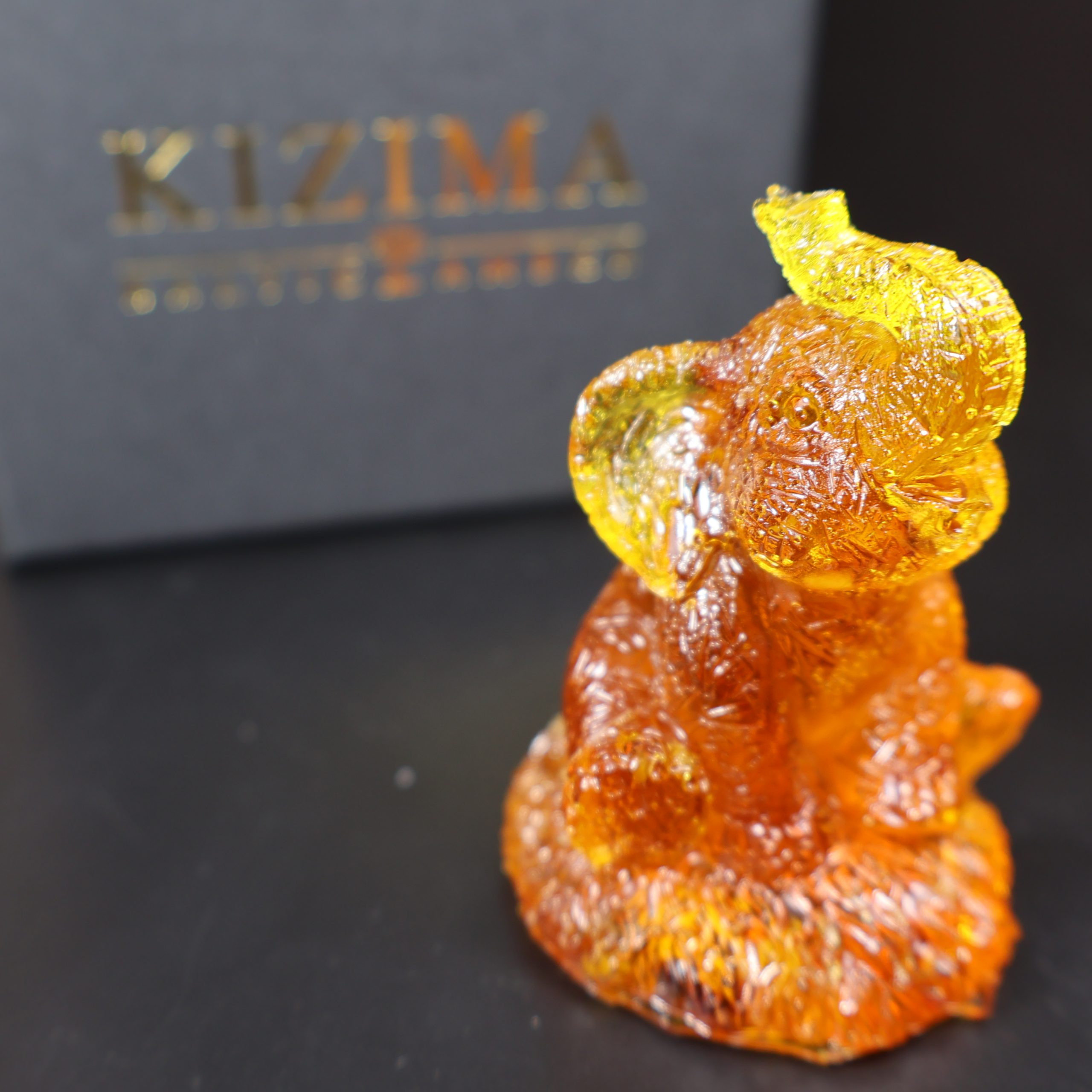 Made in USA Natural Baltic Amber seated elephant figurine trunk up by KIZIMA