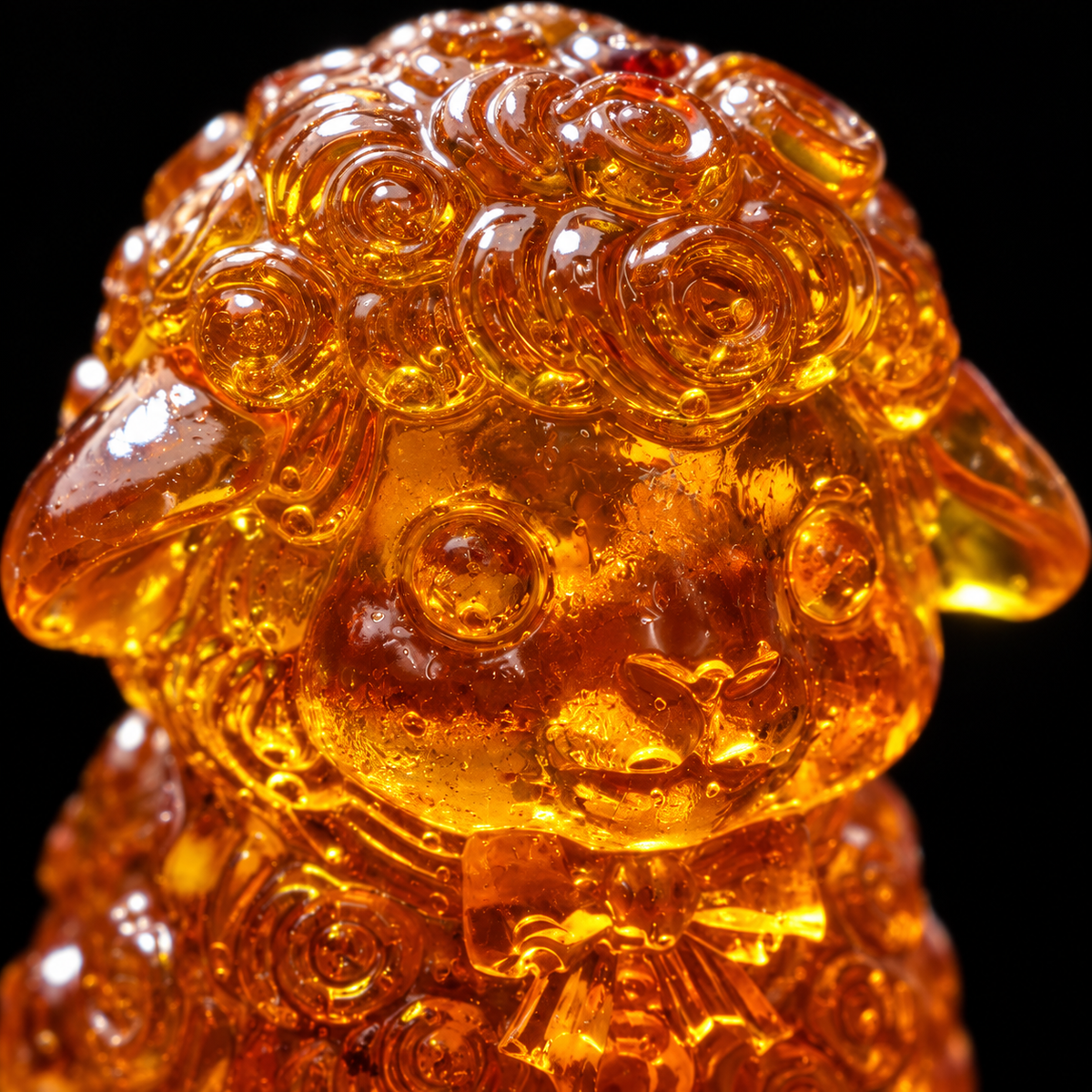 Macro detail of the sheep's face in dark honey to cognac Baltic amber, Made in USA nativity keepsake by KIZIMA®