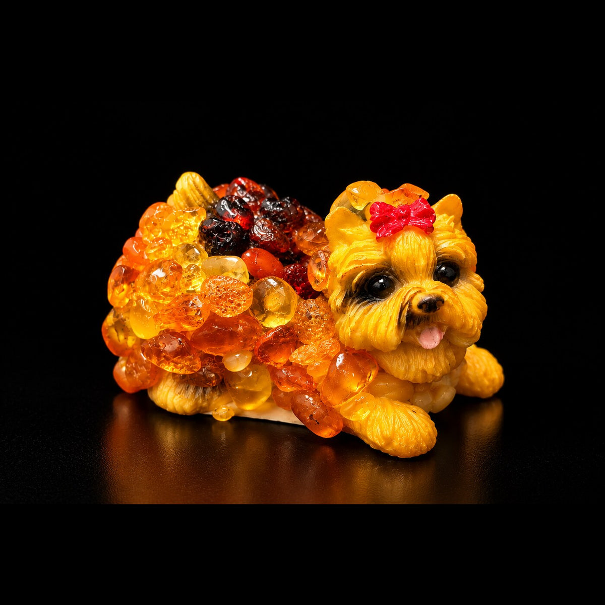 Made in USA natural Baltic amber small Yorkshire Terrier figurine, lying Yorkie with red bow in hand-laid amber mosaic on ceramic, glowing on black studio background — KIZIMA® Brooklyn NY