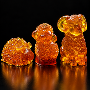 Made in USA Natural Baltic Amber Three Rams set by KIZIMA® on a black studio backdrop, sheep, lamb and ram, San Yang Kai Tai Christmas and New Year 2027 gift
