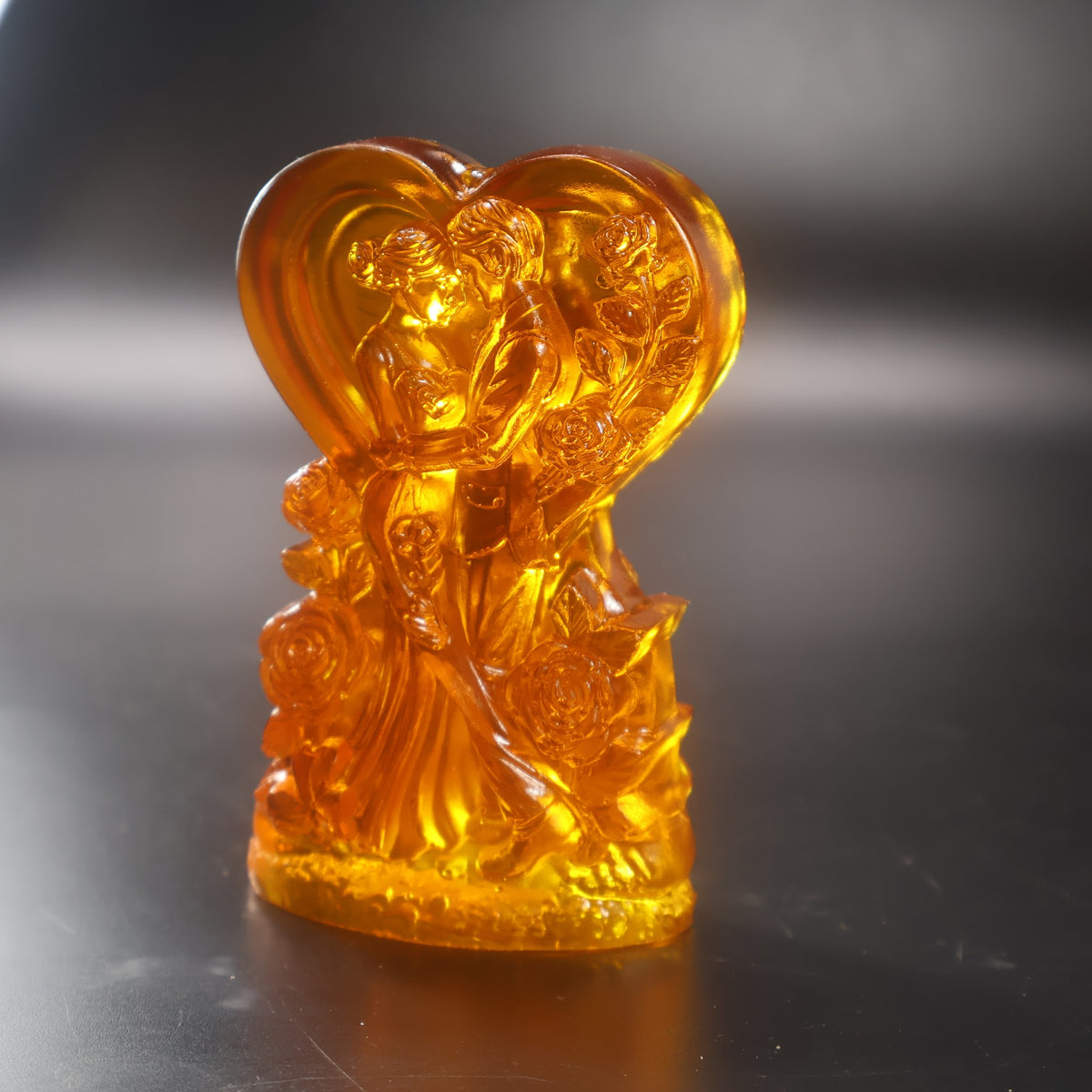 Hand-cut Baltic amber flowers on the wedding heart sculpture by KIZIMA® USA — close-up