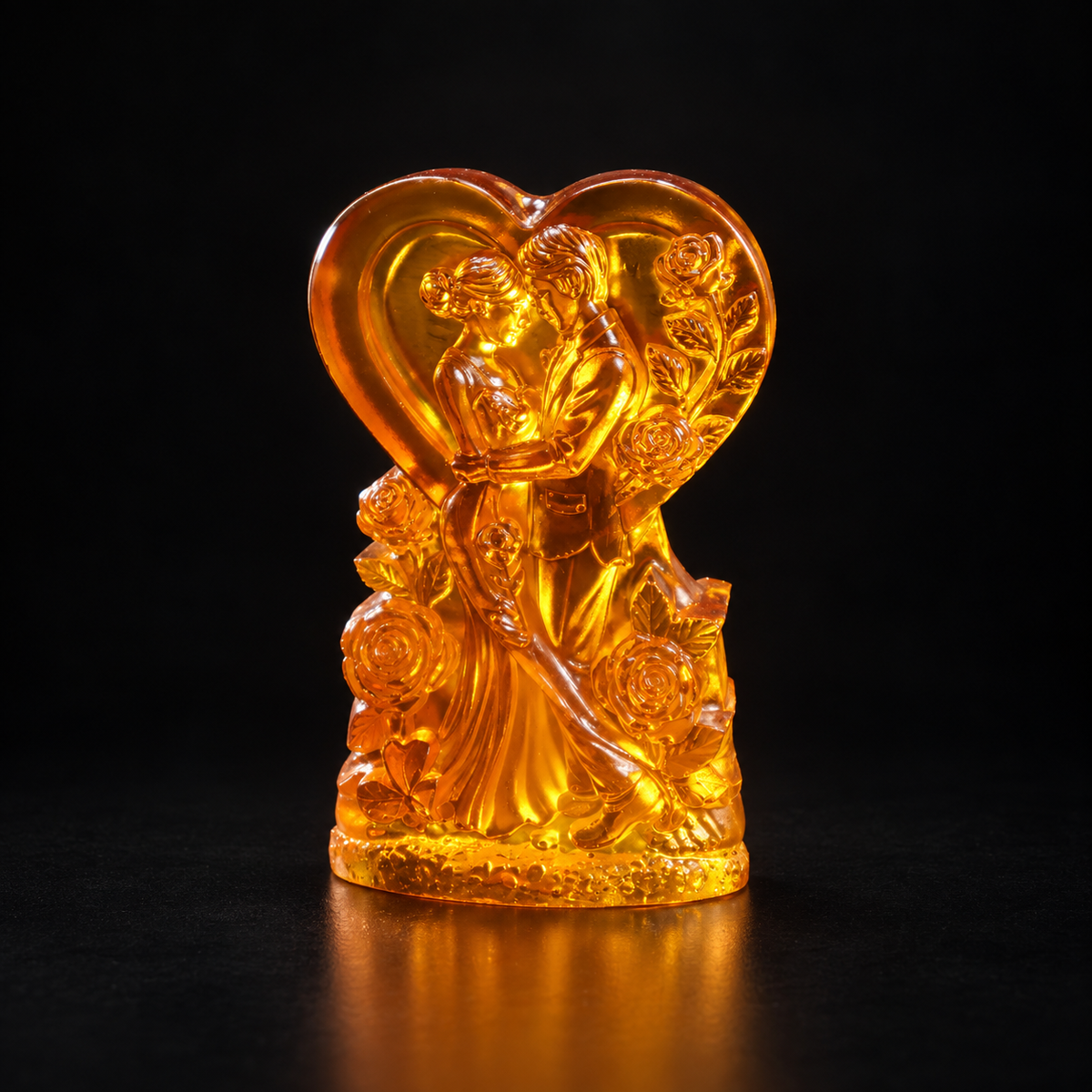 Detail of the hand-cut amber flowers and bride and groom figures on the KIZIMA® wedding heart, Made in USA